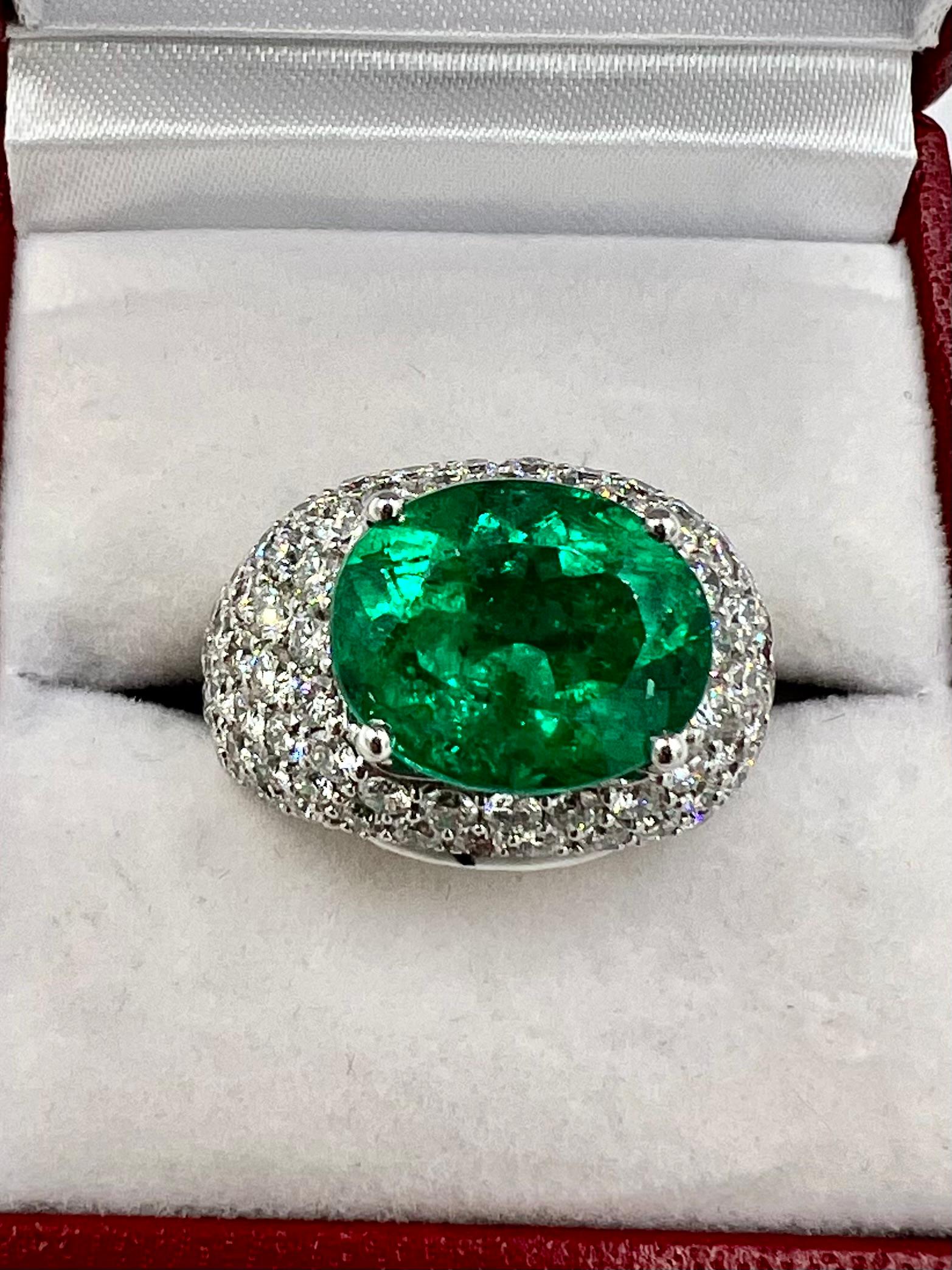 Emerald and diamond white gold dome ring, circa 1990s.

  This emerald and diamond white gold dome ring is a timeless piece of jewelry that exudes elegance and sophistication. Crafted with exquisite detail and precision, this stunning ring showcases