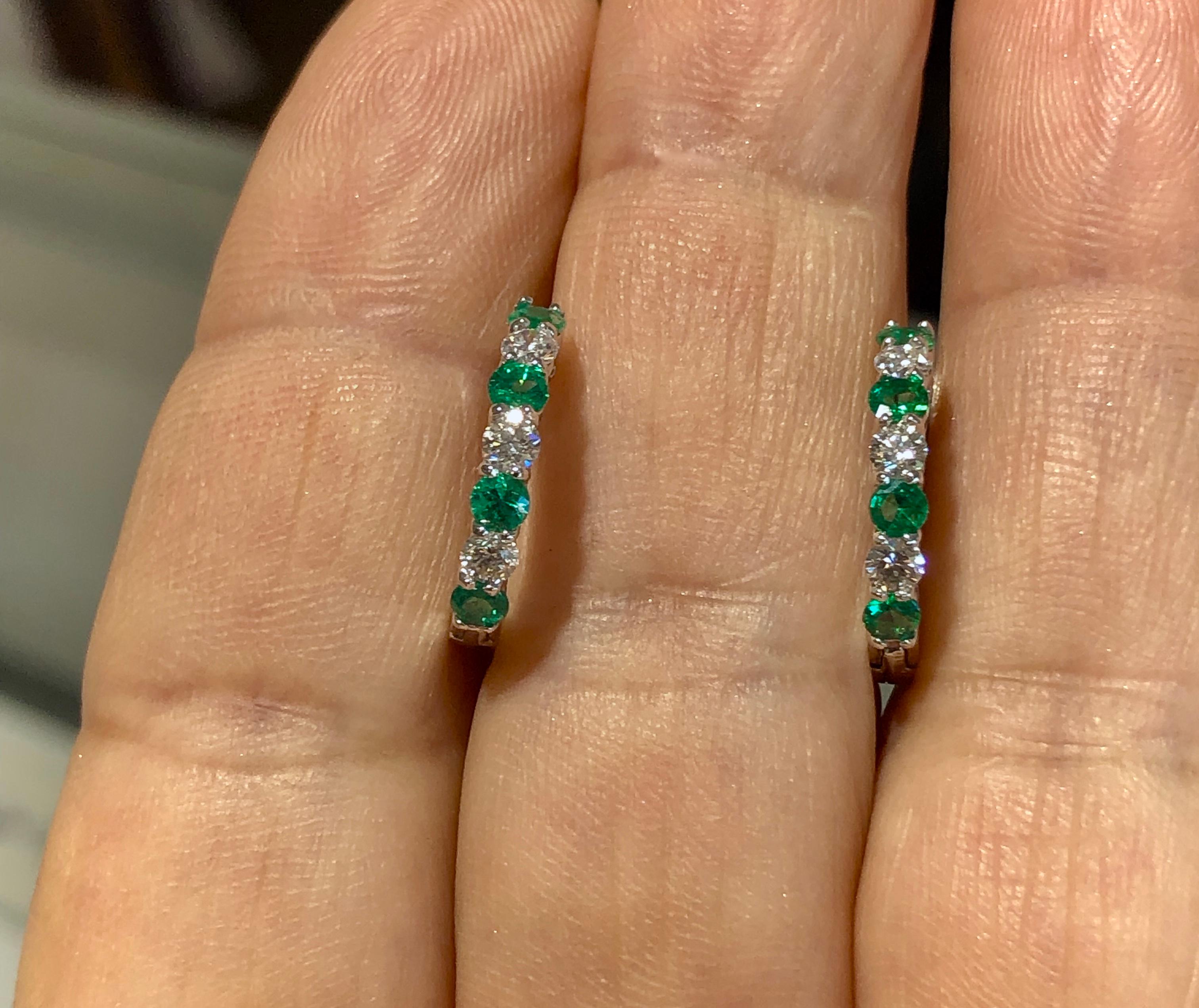 1.00 Carat Emerald & Diamond White Gold Hoop Earrings. These beautiful earrings contain round shape natural Colombian emeralds with a total weight of 0.60 cts. In between each emerald is a round shape natural diamond with a total weight of 0.40cts.