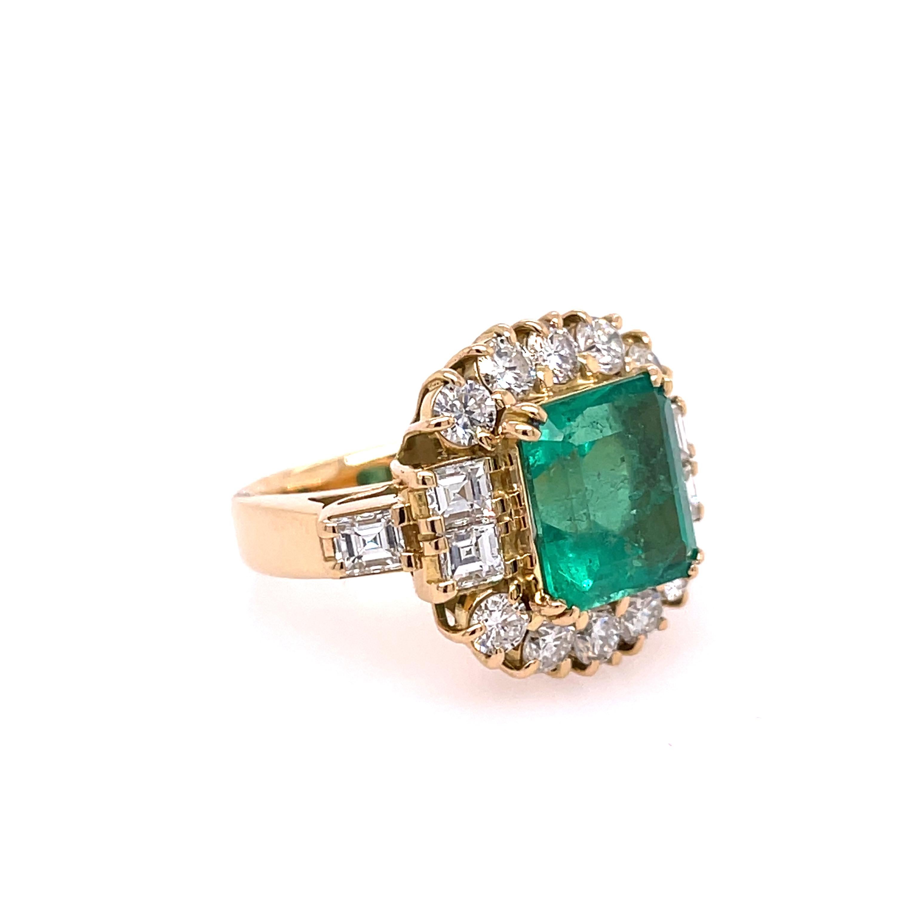 Estate Emerald and Diamond Ring in 18K Yellow Gold. The ring features a 5.03ct emerald and 2.44ctw of diamonds. Ring size 5.50, can be sized. Circa 1970s.

12.6 grams