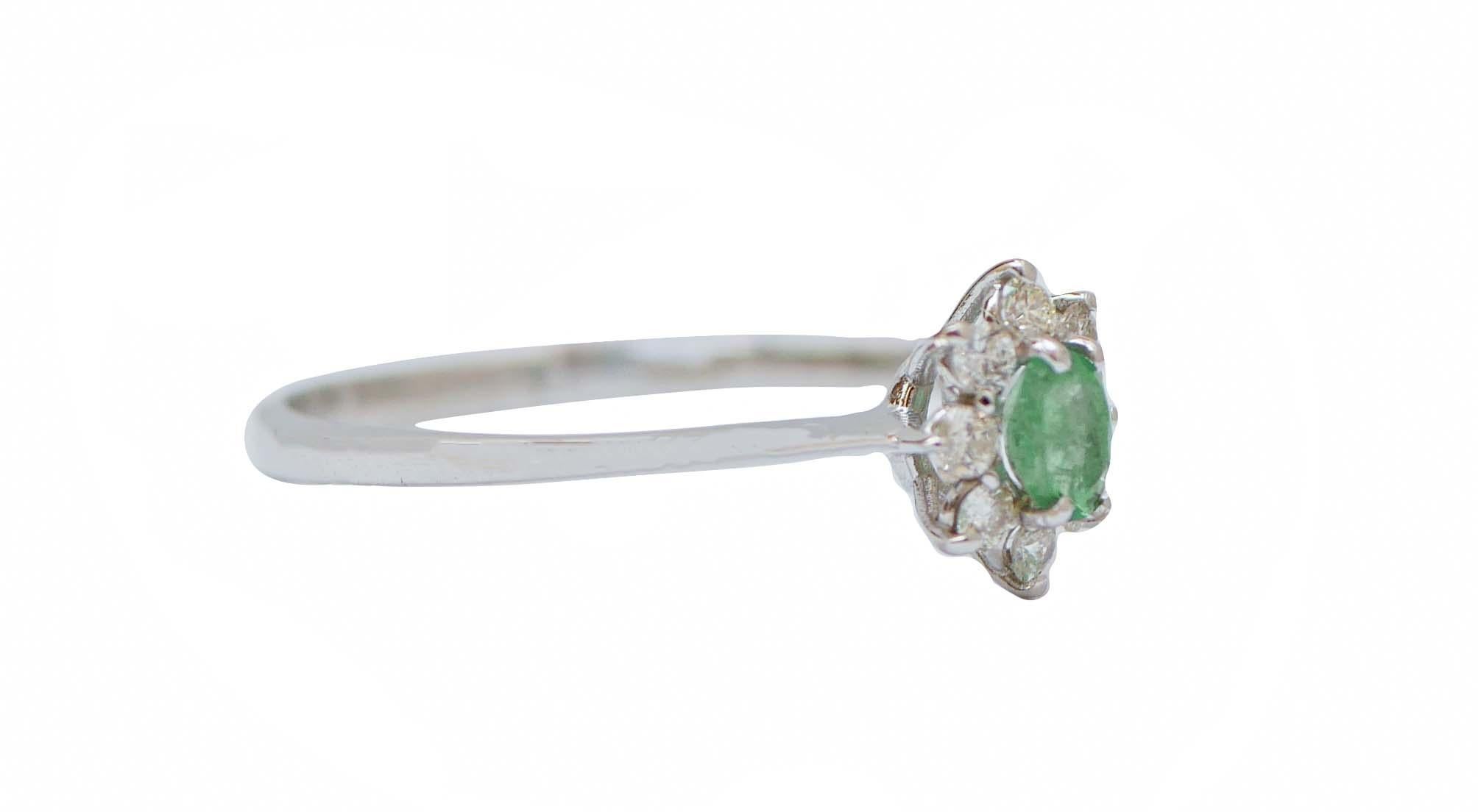 Elegant modern flower-shape ring in 18 kt white gold structure mounted with an emerald surrounded by diamonds.
Diamonds 0.23 ct
Emerald 0.27 ct
Total Weight 1.60 gr
RF  G     EIR
RK.GOF
Italian Size 17
Usa Size 8
French Size 57

For any
