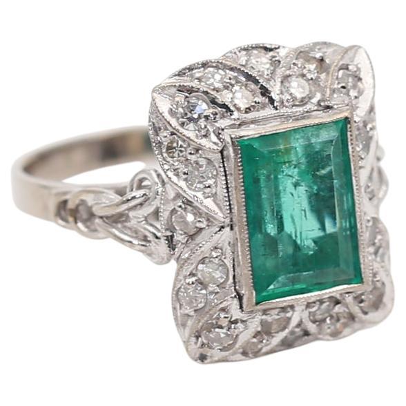 Emerald Diamonds 18K White Gold Ring. Created around 1970.

Fine Emerald rectangular cur installed in an artistically crafted White Gold ring. The Diamonds are part of the natural (floral) ornamentation. The ring looks magnificent on the hand. It is