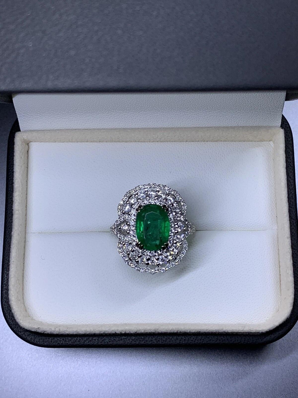 Emerald diamonds certified engagement ring 18ct white gold.