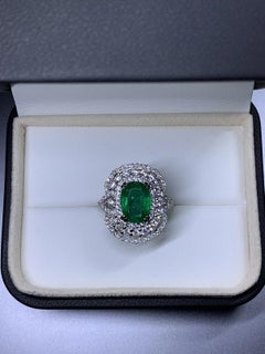Emerald diamonds certified engagement ring 18ct white gold.