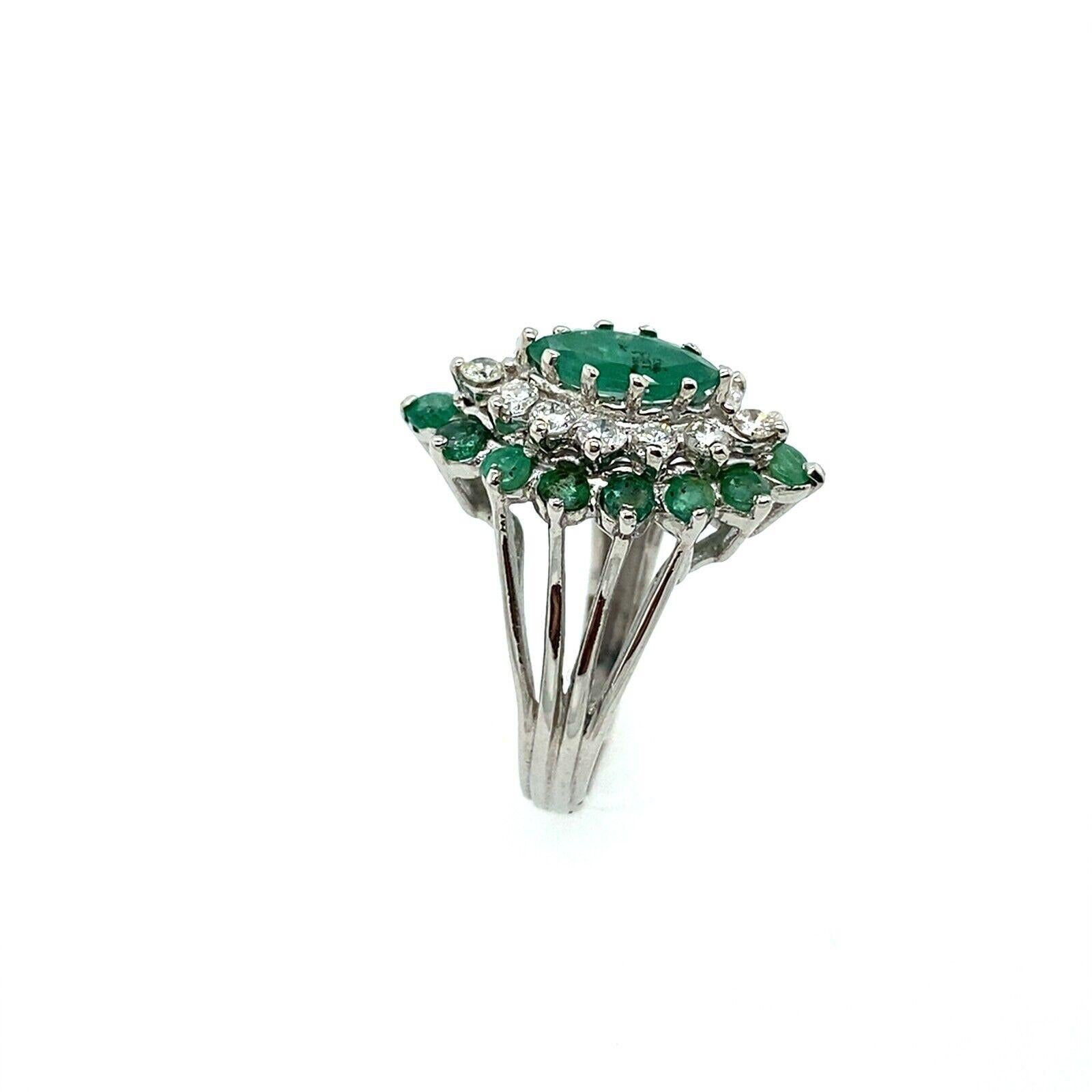 The ring features a cluster of marquise cut emeralds, with 0.75ct of round brilliant cut diamonds and 15 matching marquise shape emeralds, set in 14ct white gold. The ring is a perfect complement to any ensemble and can be worn on any