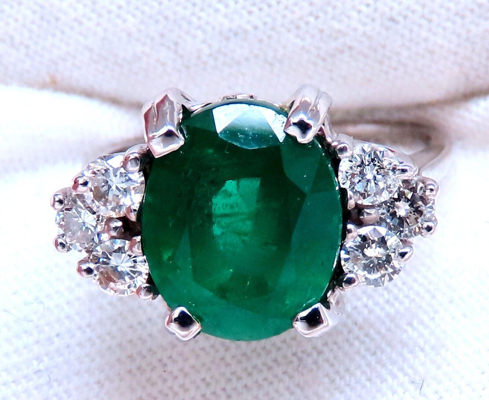 4.07ct Natural Oval emerald ring.

10 x 8mm emerald, even green clean clarity and transparent.

Oil Enhanced

.50 carat natural  round diamond

H-I color Si-1 Si-2 clarity

14 karat white gold 4.6 grams

Depth of ring 8 mm

Size 6 we may resize