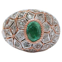 Anello con smeraldo, diamanti, oro rosa e argento.