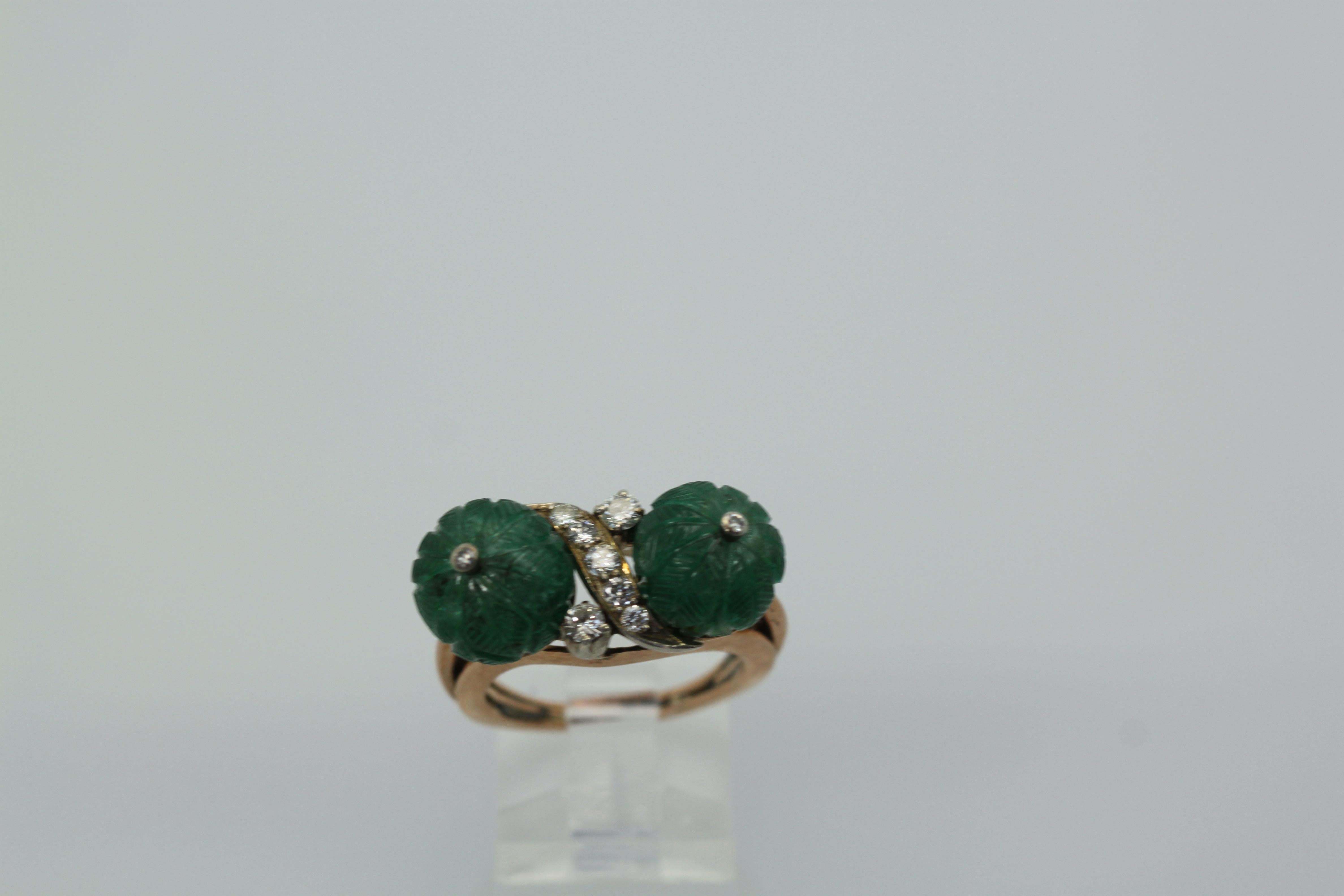 This Emerald Double Carved Diamond Ring is lovely and features two Emerald 