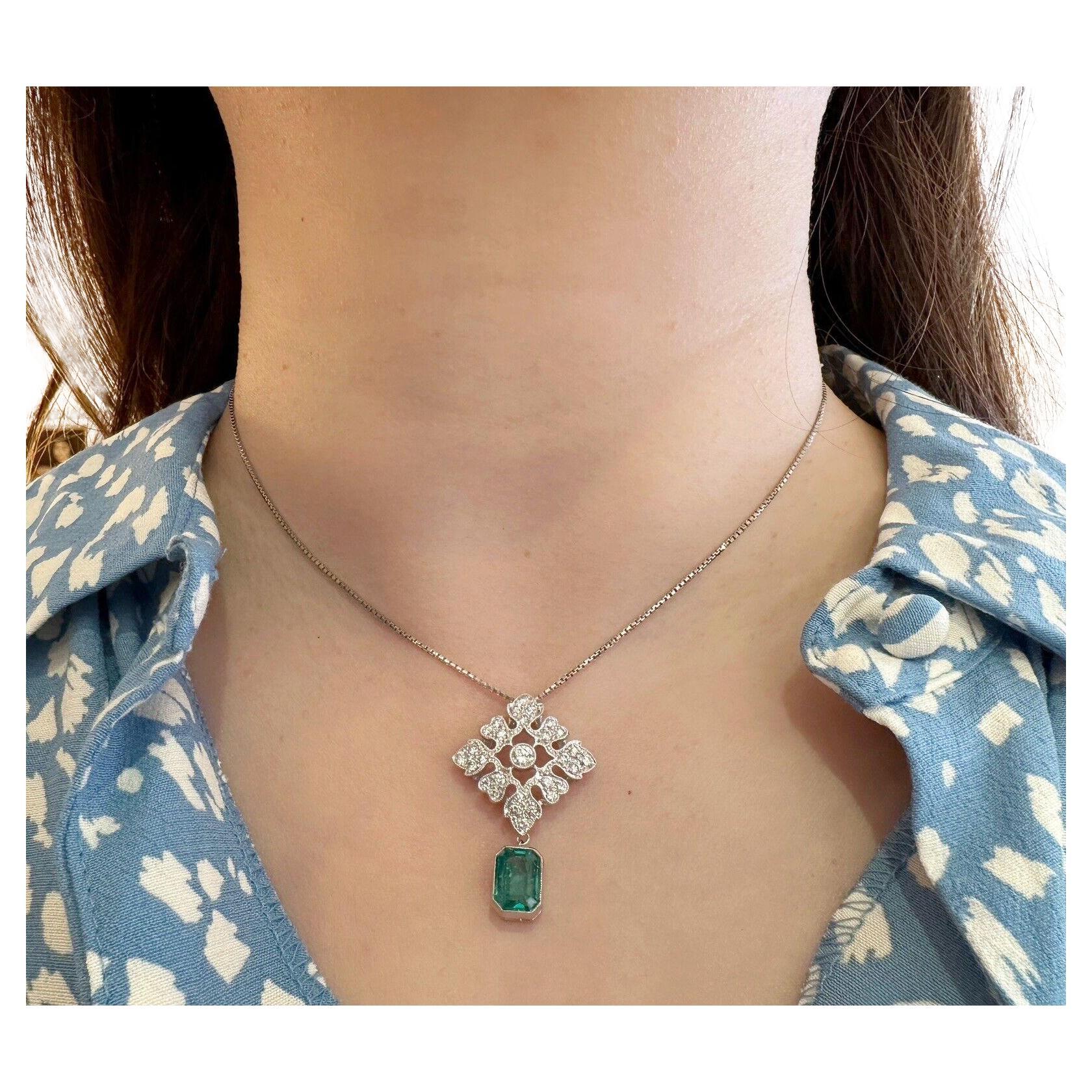 Diamond & Emerald Drop Pendant Necklace in Platinum

Emerald and Diamond Necklace features a 2.04 carat Emerald cut Natural Emerald, bezel set in Platinum, hanging from a Diamond medallion with 0.76 carats of Round Brilliant Diamonds set in Platinum
