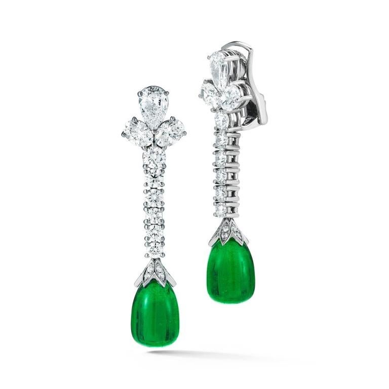 EMERALD DROP EARRING A waterfall of bright diamonds culminates in two vibrant Emerald drops. Item: # 02592 Metal: 18k W Lab: Gia Color Weight: 15.16 ct. Diamond Weight: 5.39 ct.
