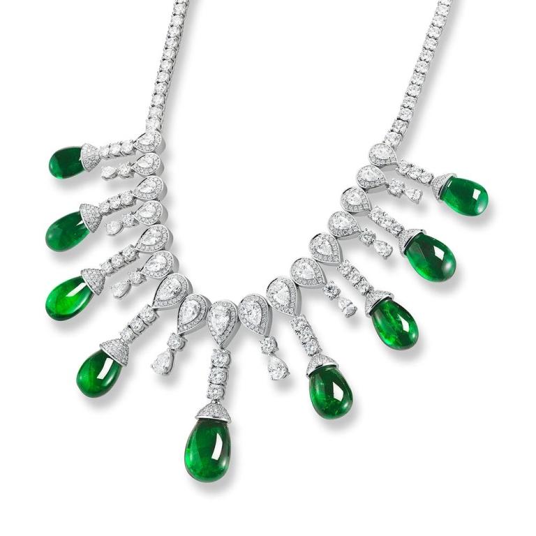 EMERALD DROP NECKLACE A stunning collection of certified Emerald drops is suspended from a masterful diamond necklace. A concept inspired by the magnificence of the Emeralds, this piece took over 350 hours of labor Item: # 02594 Metal: 18k W Lab: