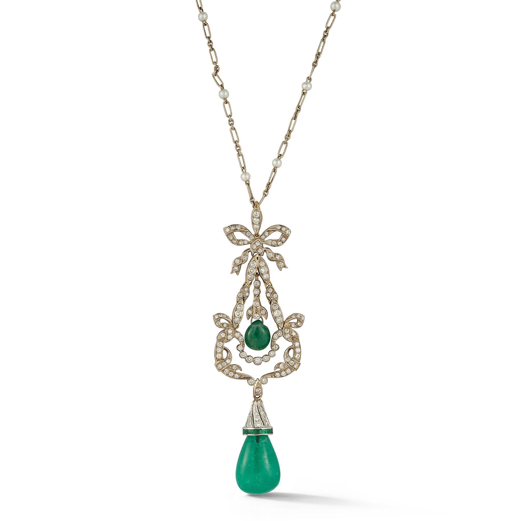 Emerald Drop Pendant Necklace

An 18 karat white gold pendant set with round cut diamonds and 2 cabochon emerald drops on an 18 karat white gold chain with 20 pearls evenly spaced throughout

Approximate Total Emerald Weight: 18.85 carats

Chain