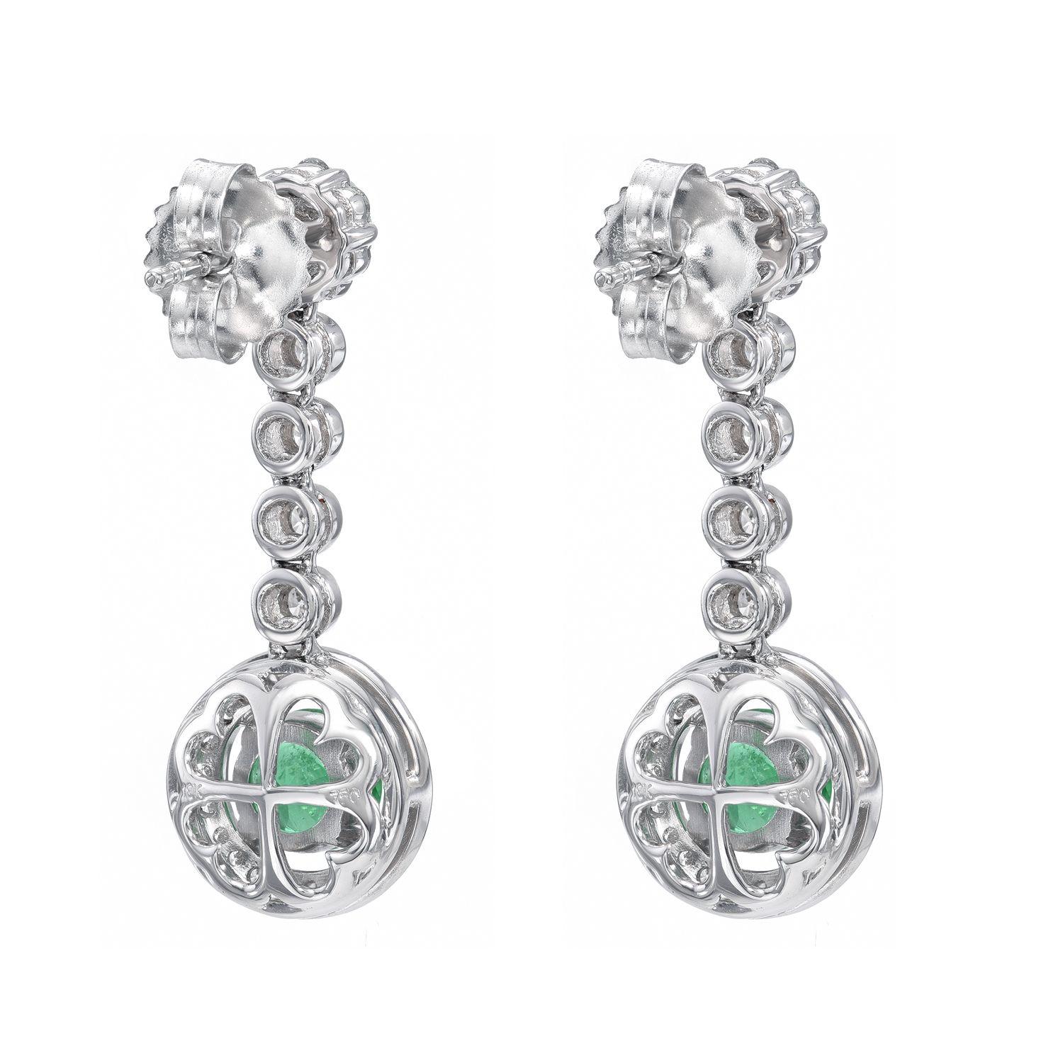 18K white gold earrings, featuring a pair of round Emeralds weighing a total of 0.98 carats, adorned by diamonds weighing a total of 0.70 carats.
Approximately 1 inch in length.
Returns are accepted and paid by us within 7 days of delivery.

Emerald