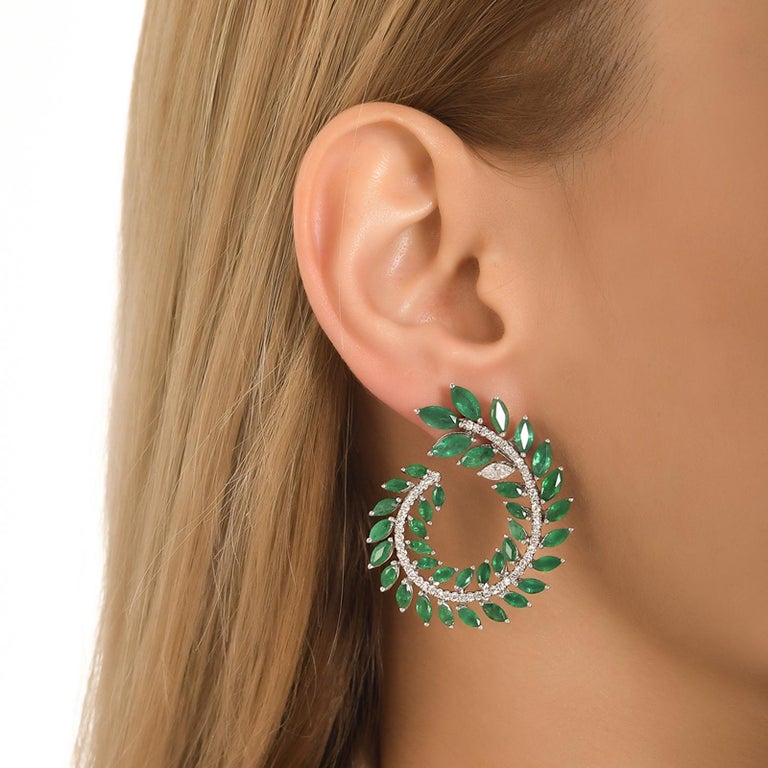 These glam galore dramatic emerald and diamond leaf earrings come in various 18K white gold, yellow gold, and rose gold and can be customized.

These delicate sparkling earrings would be the perfect accessory for any evening occasion.

18 Karat