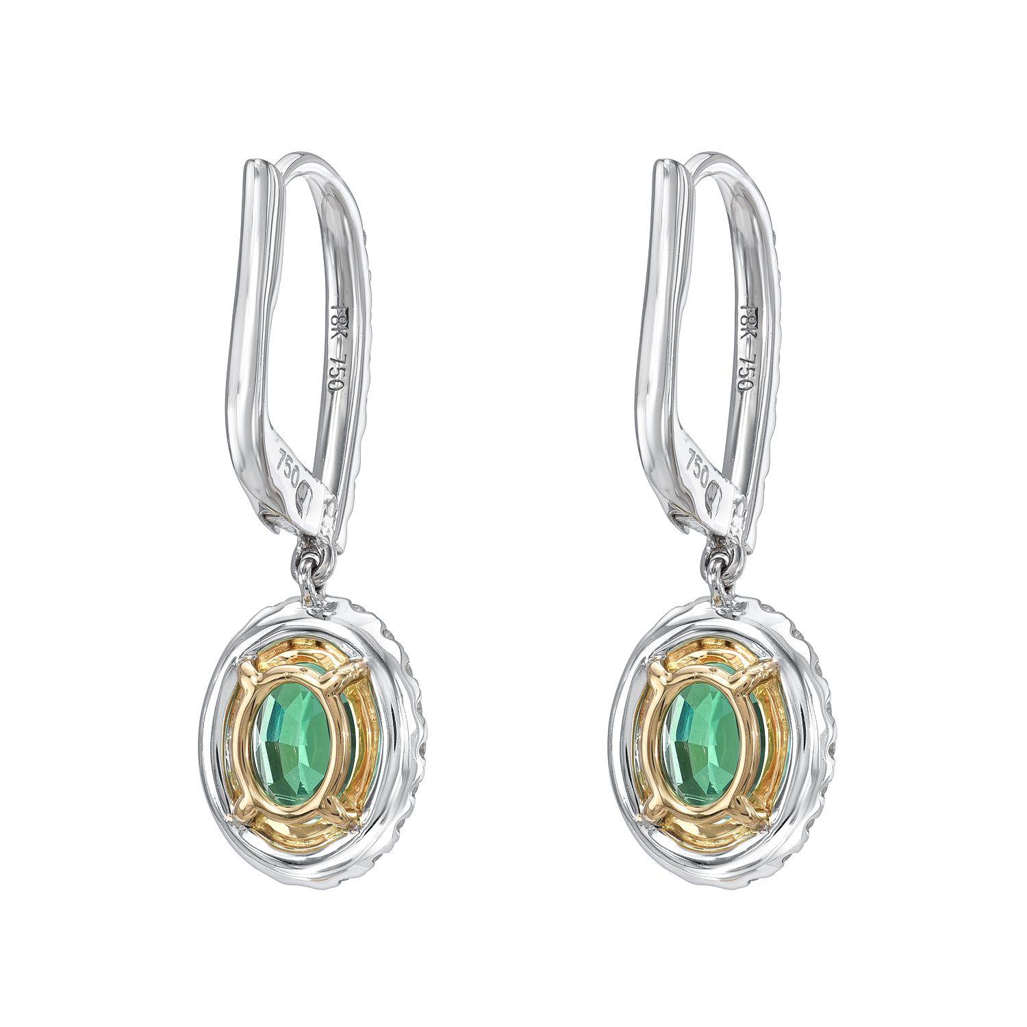 18K white and yellow gold lever-back earrings, featuring a pair of oval Emeralds weighing a total of 1.48 carats, adorned by diamonds weighing a total of 0.56 carats.
Approximately 1 inch in length.
Returns are accepted and paid by us within 7 days