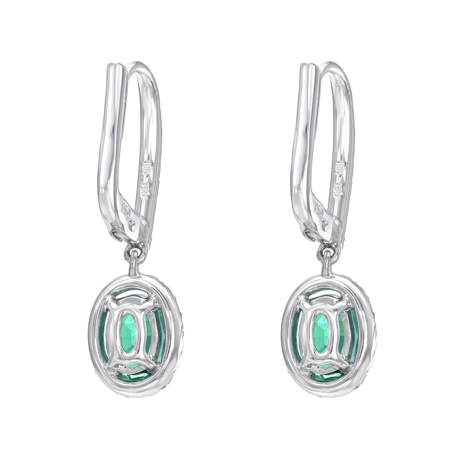 18K white gold lever-back earrings, featuring a pair of oval Emeralds weighing a total of 1.50 carats, adorned by diamonds weighing a total of 0.50 carats.
Approximately 1 inch in length.
Returns are accepted and paid by us within 7 days of