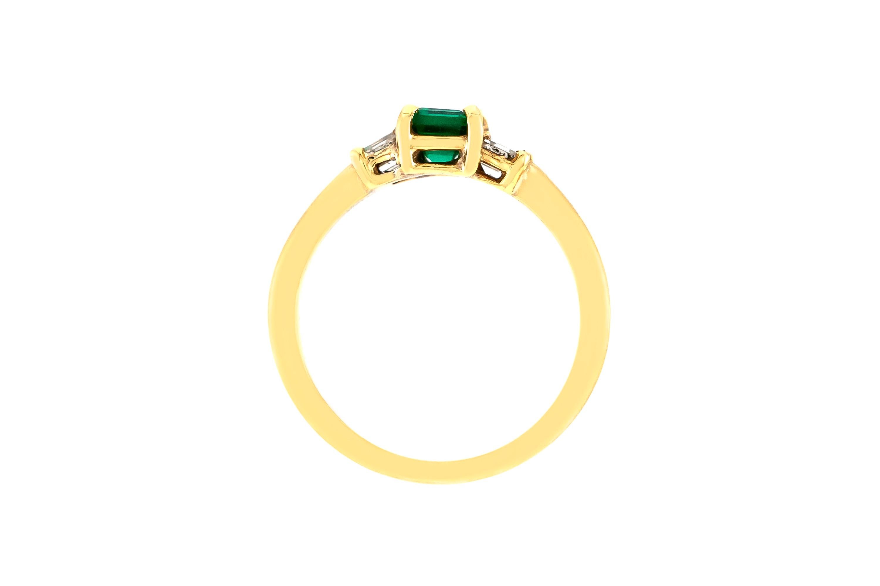 The ring is finely crafted in 18k yellow gold with center emerald weighing approximately total of 0.45 carat and diamonds weighing approximately total of 0.27 carat.
Circa 1970.