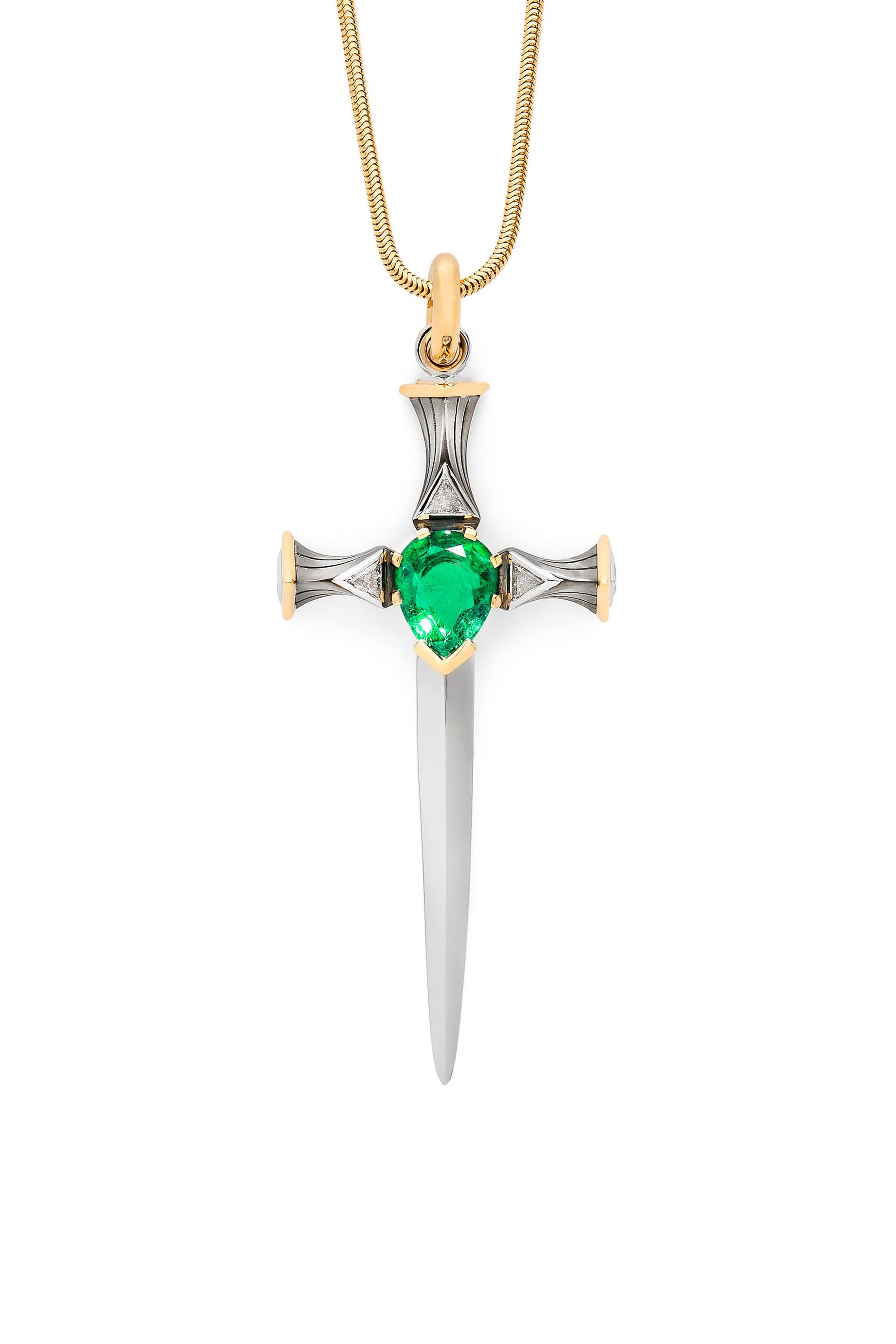 Épée with a gold and distressed silver handle, featuring in its center a pear-shaped emerald surrounded by triangular diamonds, extending into a mirror-polished platinum blade. Openable gold bail. 

Sold without chain.

Available with chain on