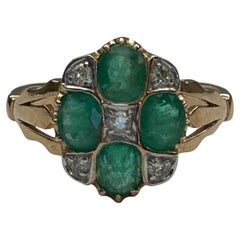 Emerald (Est 1.5ct) & Diamond (Est 0.12ct) Cluster Ring, 9ct Yellow Gold.