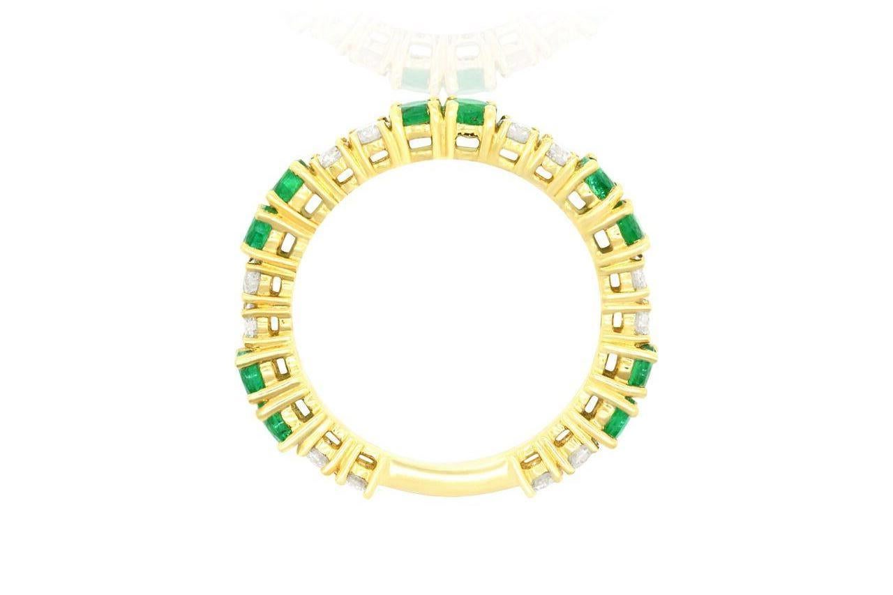 Material: 18k Yellow Gold
Color Stone Details: 10 Round Cut Emeralds at 1.07 Carats
Center Stone Details: 12 Round Cut White Diamonds at 3.57 Carats Clarity: SI / Color: H-I
Ring Size: Size 6.5 This ring can be remade in your size. Price may vary