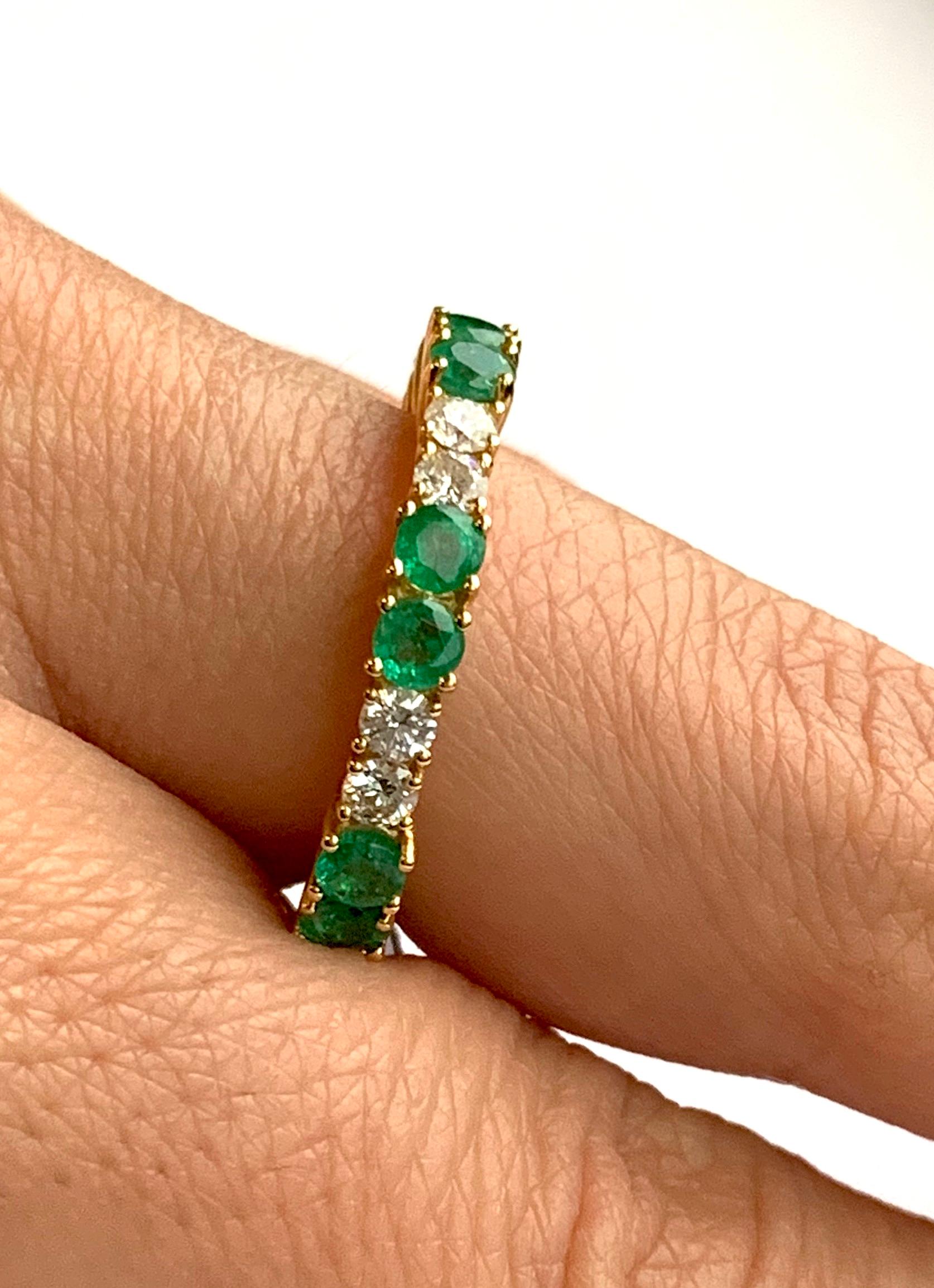 Round Cut Emerald Eternity Band in Yellow Gold