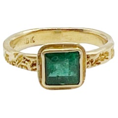 Watery Emerald Cut 1.10 Carat set in 18 Karat Gold Ring