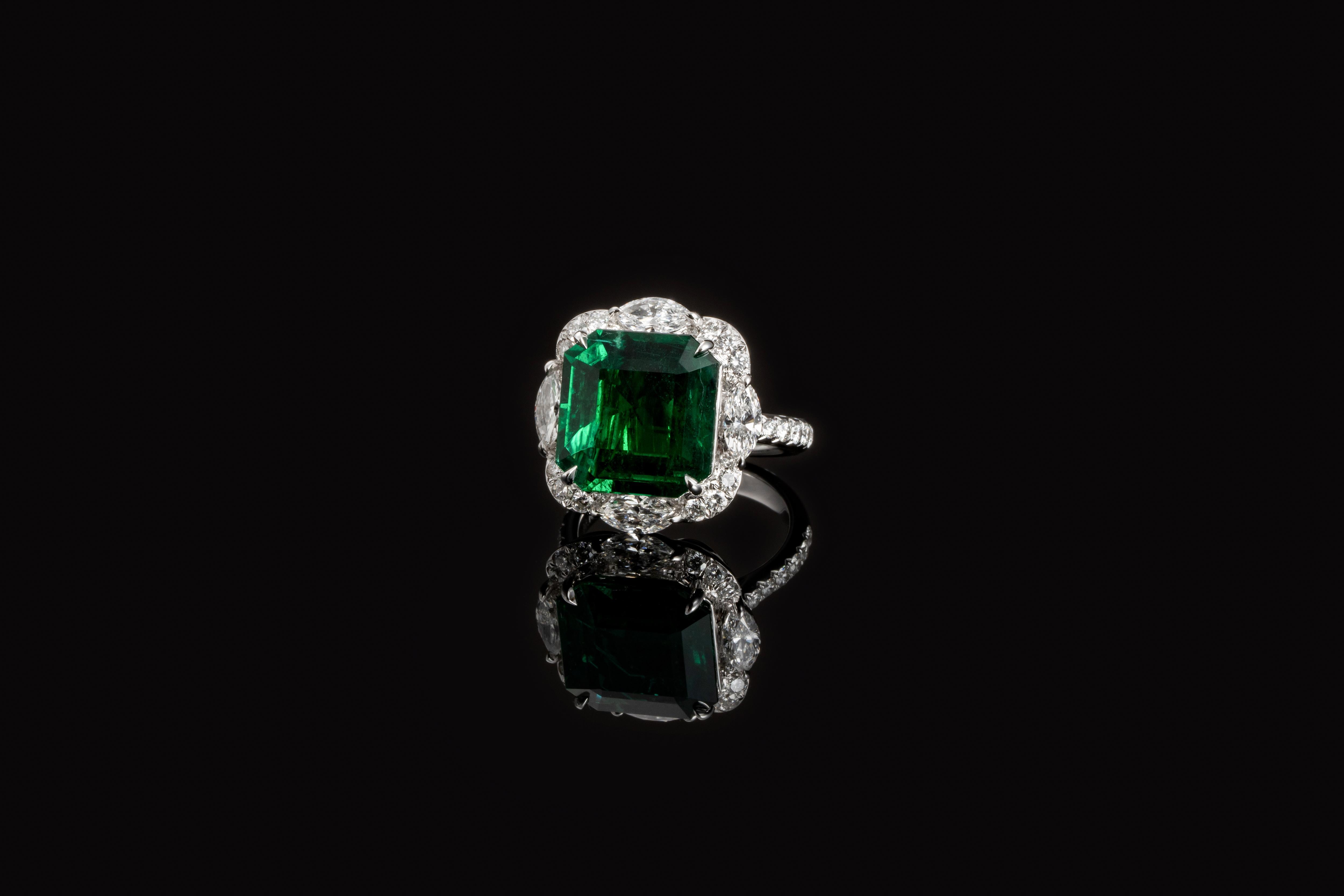 Octagonal Zambia Emerald 7.59ct in the centre, 
GRS certified as Vivid Green with minor quality,
Mounting with all Marquise diamond
Size:12.97x12.76x6.56mm