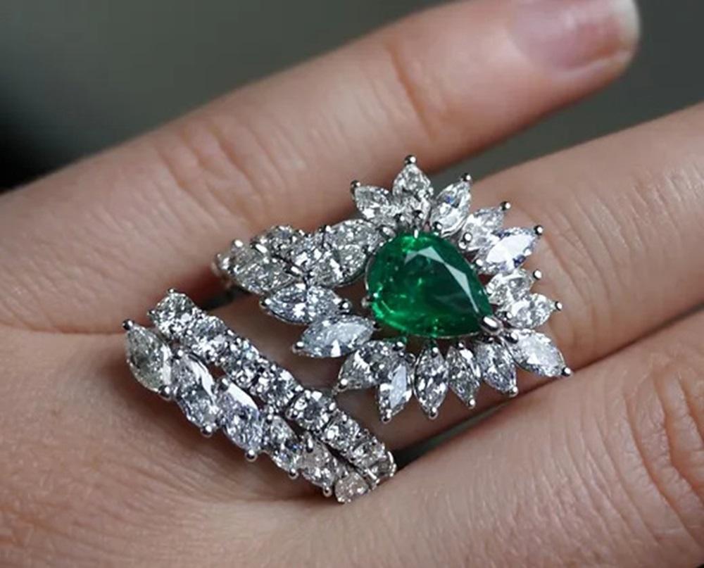 Emerald Weight: 1.92 CT, Diamond Weight: 4.82 CT, Metal: 18K White Gold, Ring Size: 7, Shape: Pear, Color: Green, Birthstone: May