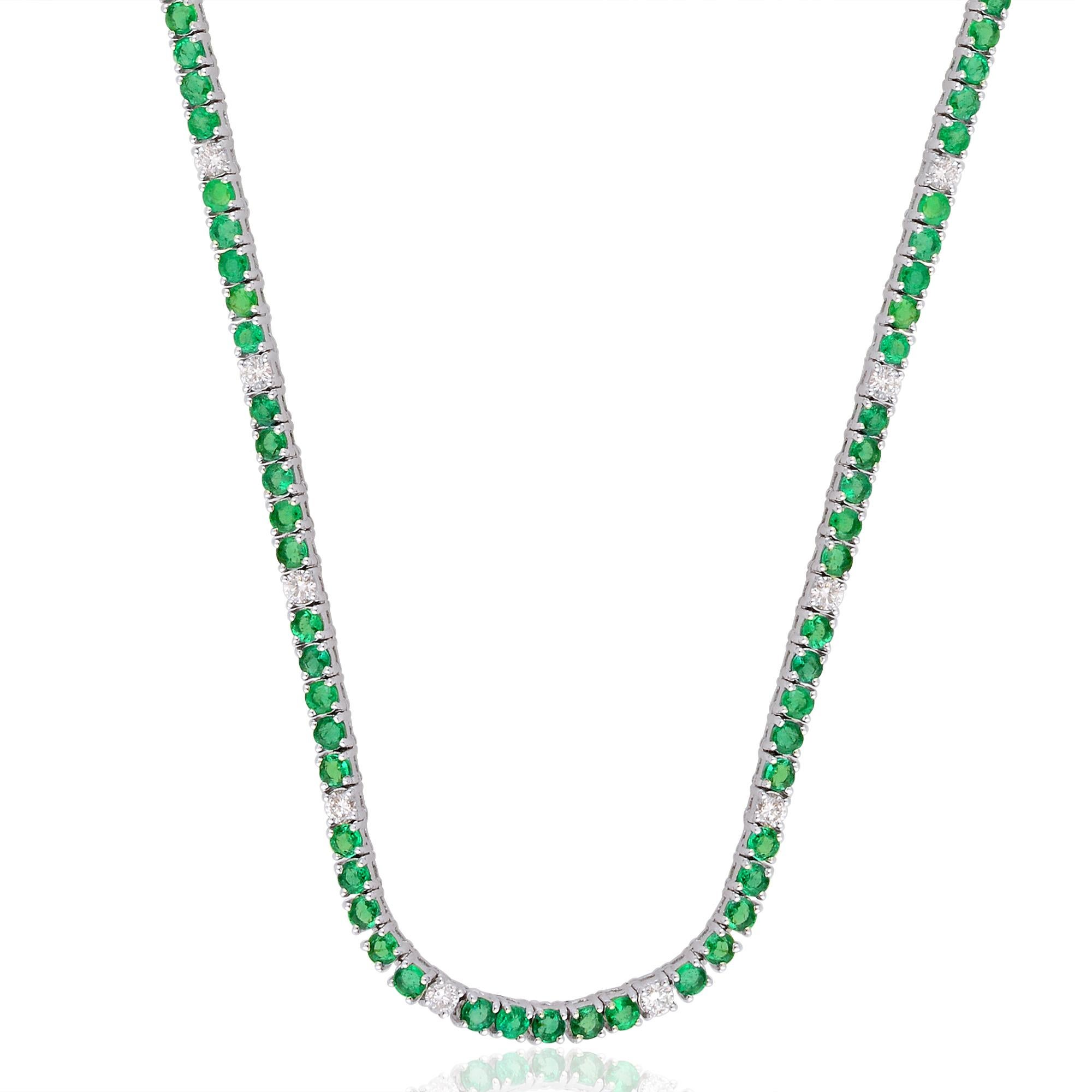 This stunning chain necklace features an emerald gemstone adorned with diamonds, set in 10 karat white gold. Meticulously handcrafted with attention to detail, this piece of jewelry exudes elegance, sophistication, and exceptional