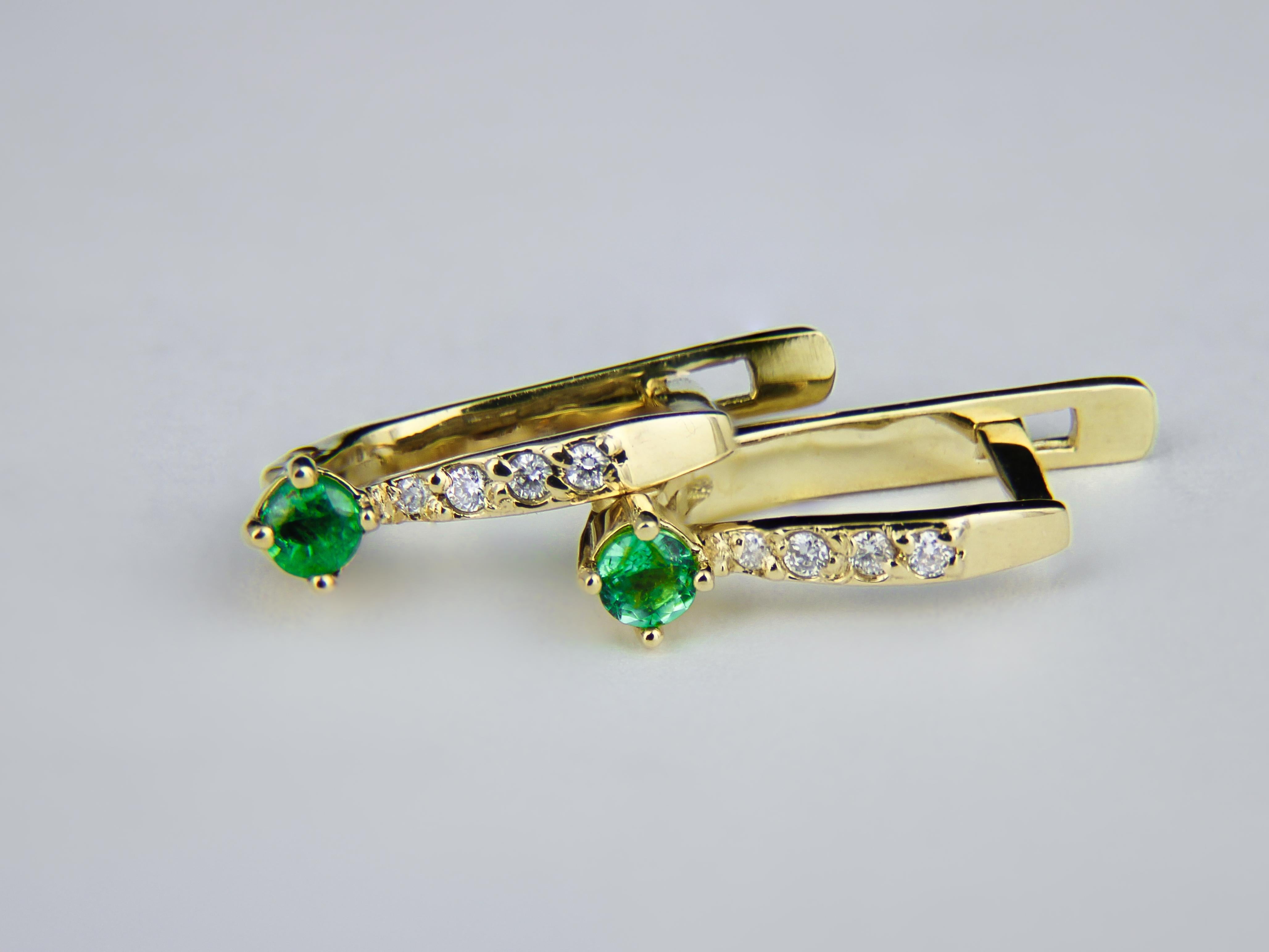 Emerald gold earrings. 

Tiny emerald earrings. Gold earrings for girl. Delicate emerald earrings. 14k Gold Earrings With Emeralds, Diamonds.

Total weight: 2 g.
Gold -14k gold
Size: 16.4 x 3.65 mm.

Central stones: Emeralds
Cut: Round
Total weight: