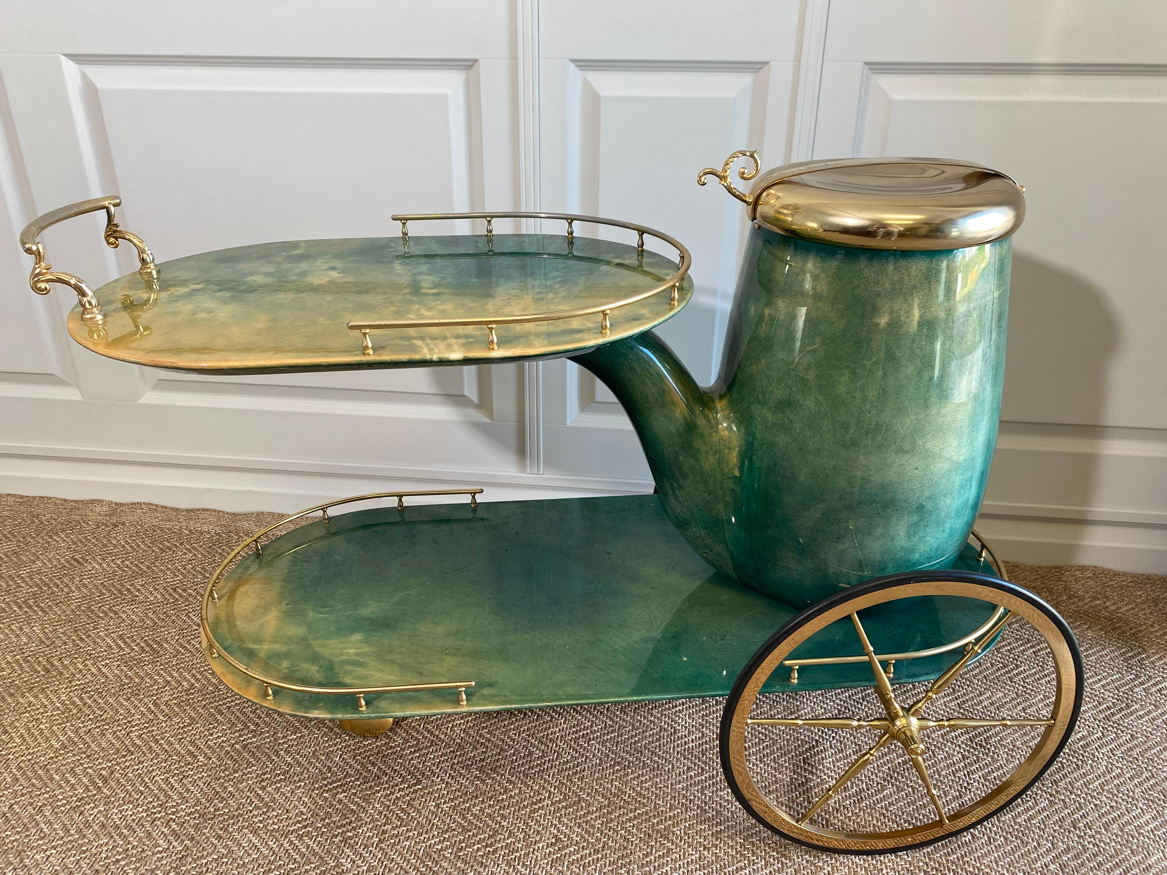 We are delighted to have found this rare and most iconic pipe-shaped ALDO TURA bar cart in the most sought after emerald green (or 