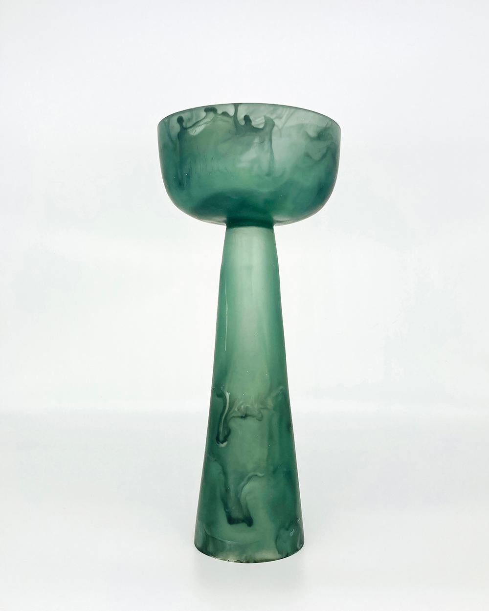 This emerald high resin pedestal bowl is a beautiful example of the artisanal craftsmanship that goes into each piece designed by Monica Calderon and handmade by expert artisans in Mexico. The high resin pedestal bowl in emerald is made from a