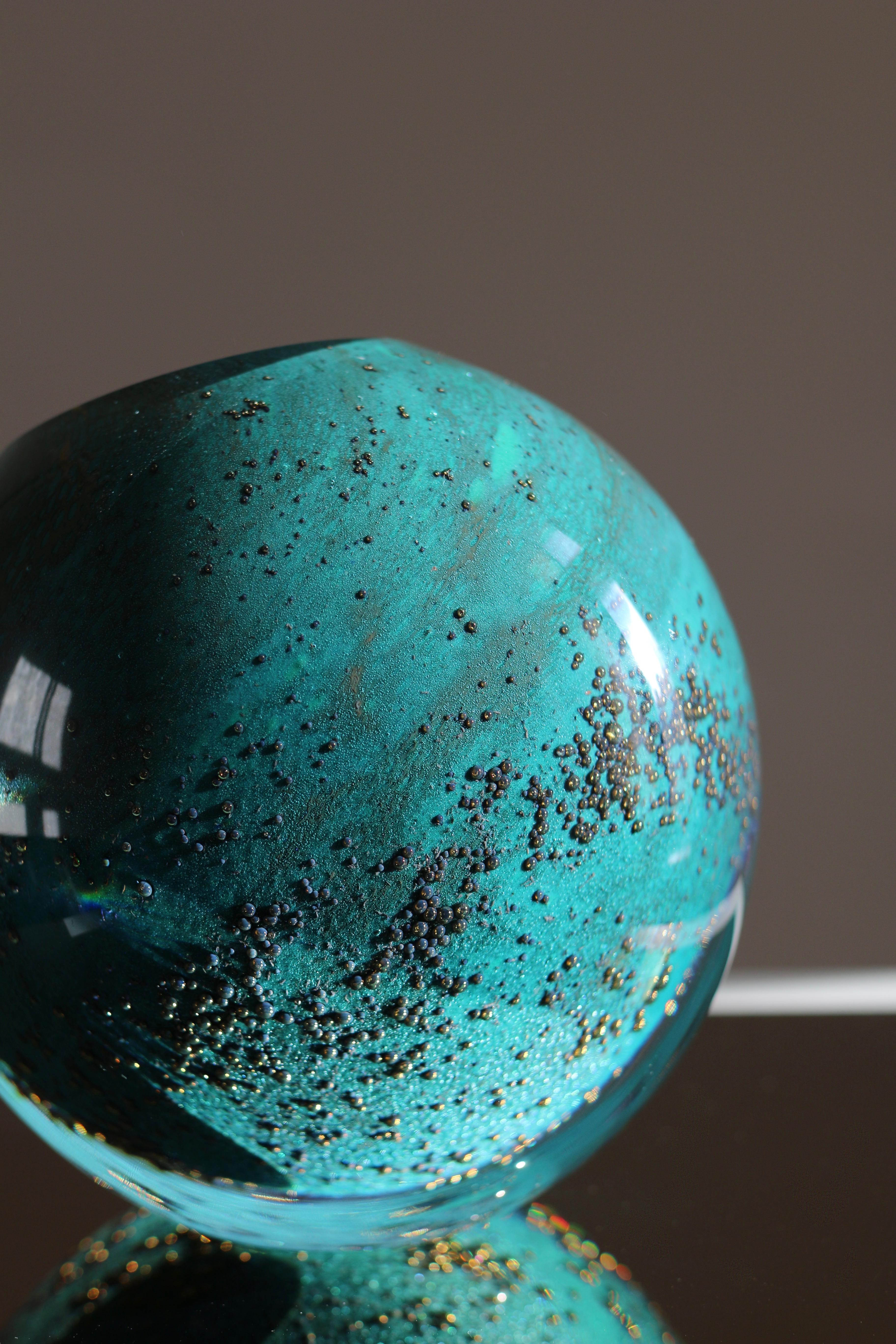 Freeform mouth-blown glass vase in intense emerald greed, canary and gold tone inclusion clusters.
Extra-clear top quality and lustrous glass.
This contemporary small scale sculpture is a unique piece from collection Experimental. 
Handmade by a
