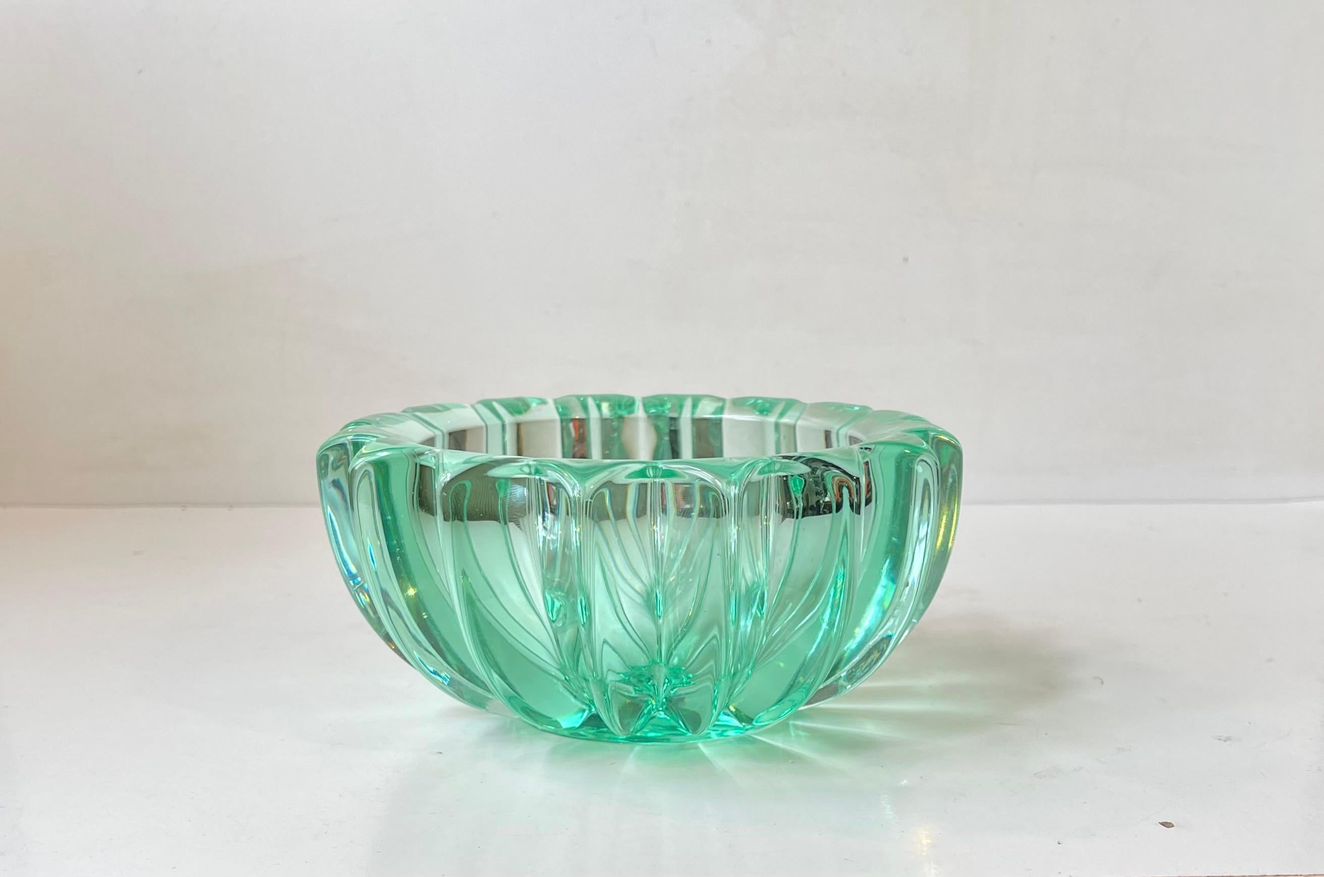 Thick fluted Glass bowl designed by Pierre D’avesn alias Pierre Gire during the late 1930s or early 1940s. It resembles a shooting star. Made by adding chromium oxide and iron oxide during glass fusion process to achieve this distinct and vibrant