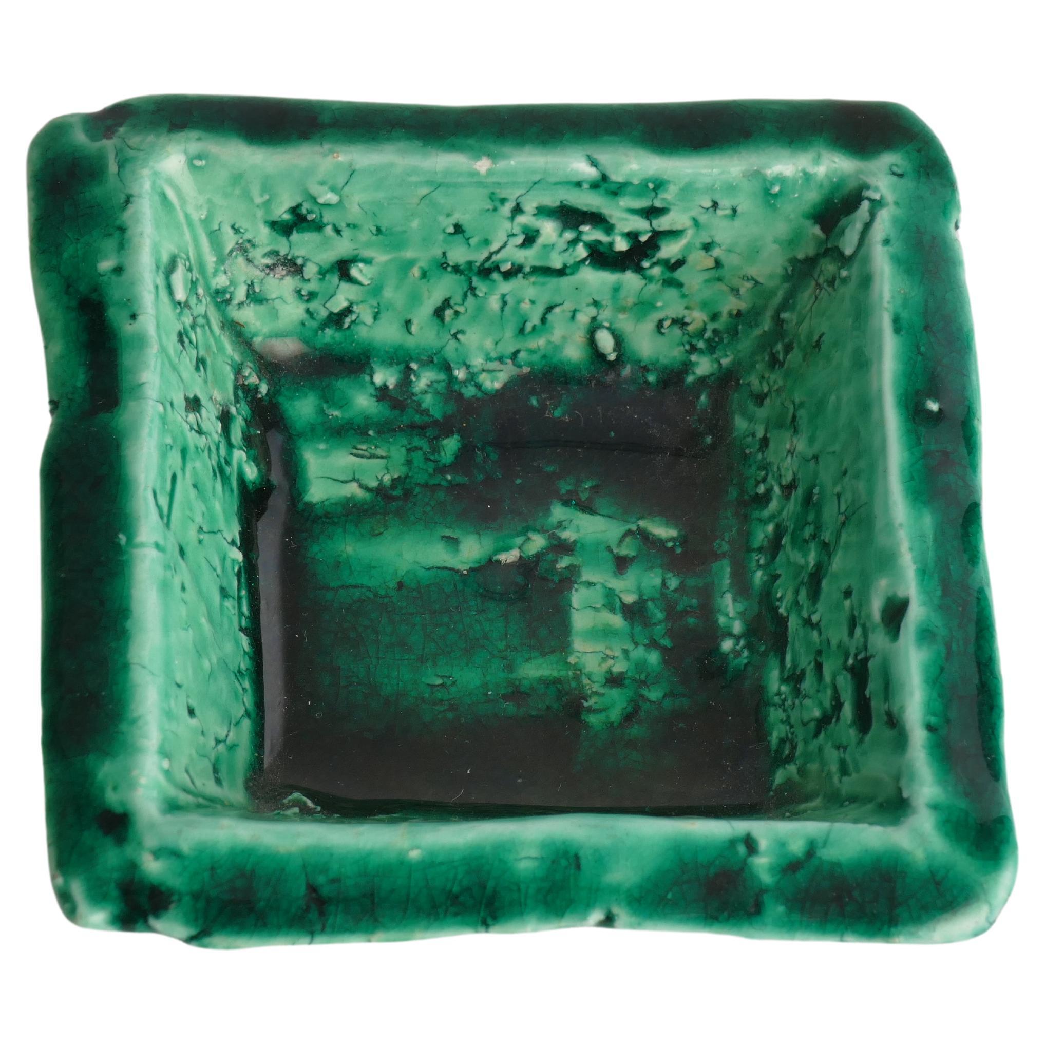 This petite emerald green chamotte bowl by renowned ceramic artist Gunnar Nylund for Rörstrand, may be small in size, but it exudes an undeniable charm that effortlessly elevates any space.

Immerse yourself in the allure of emerald or malachite