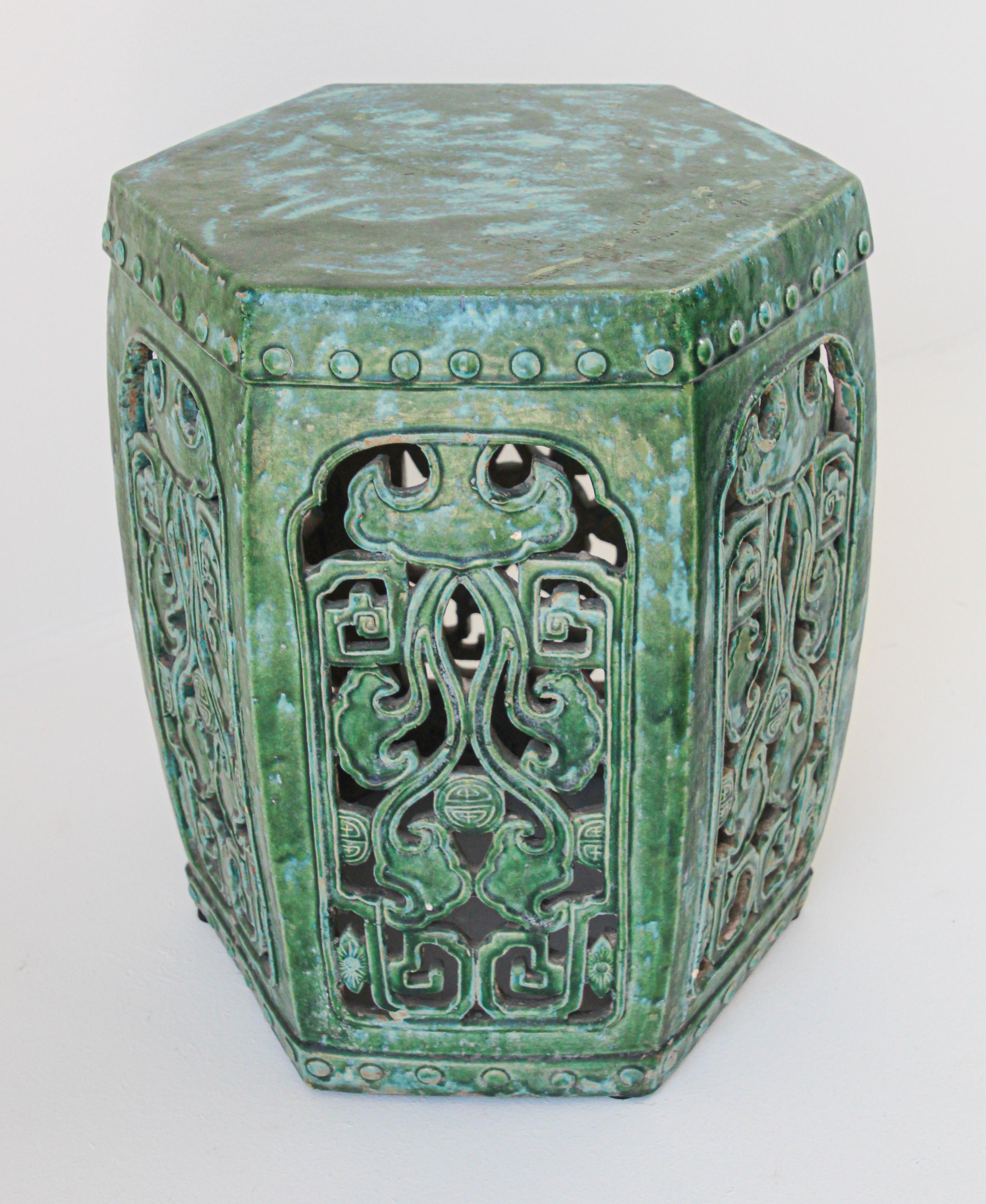 Large emerald green large Chinese ceramic garden stool.
Nicely carved on each sides with Fen Shui designs and foliages with raised dots around top.
Chinese export emerald green ceramic glaze stool great to use indoor or outdoor as a stool, end