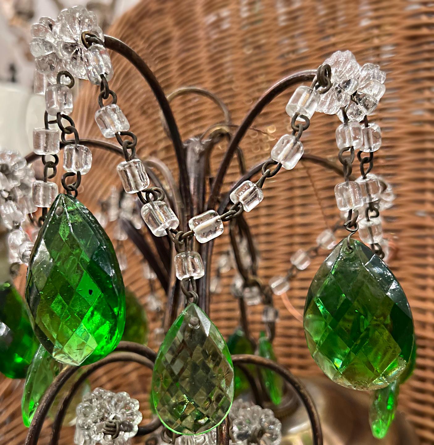 A circa 1950's French crystals chandelier with 3 candelabra lights.

Measurements:
Height: 24