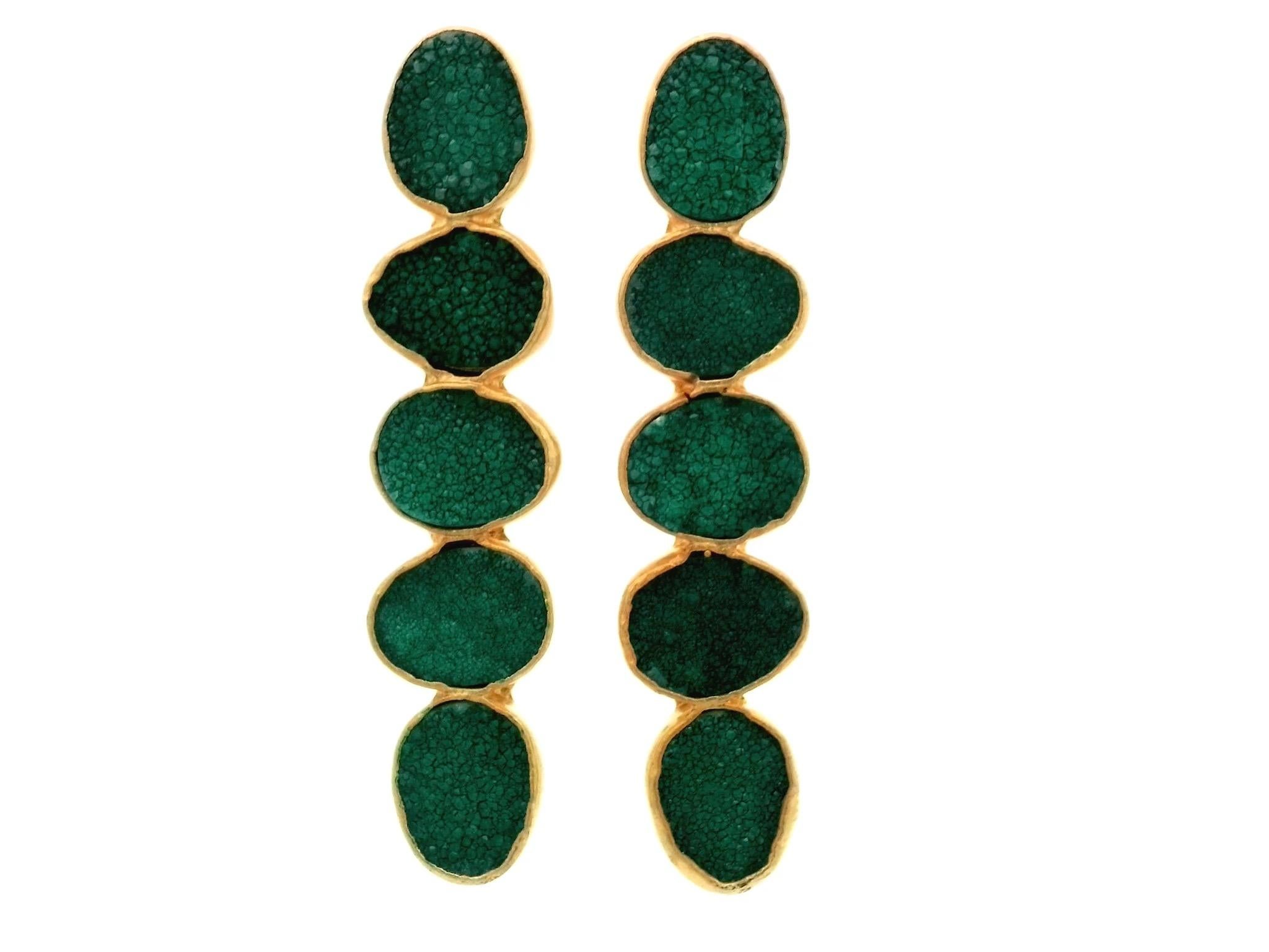 These Emerald Green Druzy Gold Plated Drop Earrings Oval Stacks are a true masterpiece of jewelry design. They are crafted with meticulous attention to detail and a focus on sophistication and elegance.

At the heart of these earrings are exquisite