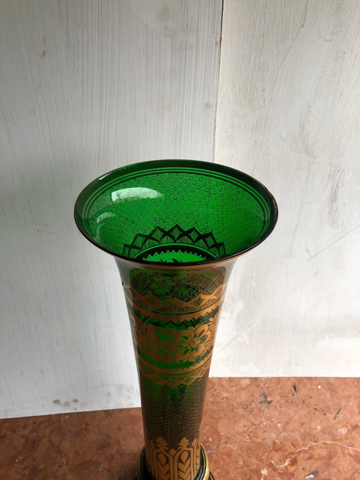 A massive Bohemian Moser Tulip/Flower vase. An extremely decorated Emerald green colored vase with 24-karat gold gilt in good condition with artwork to imitate scales, and scenes of royal imperial gilding. No cracks or chips on glass, some wear on