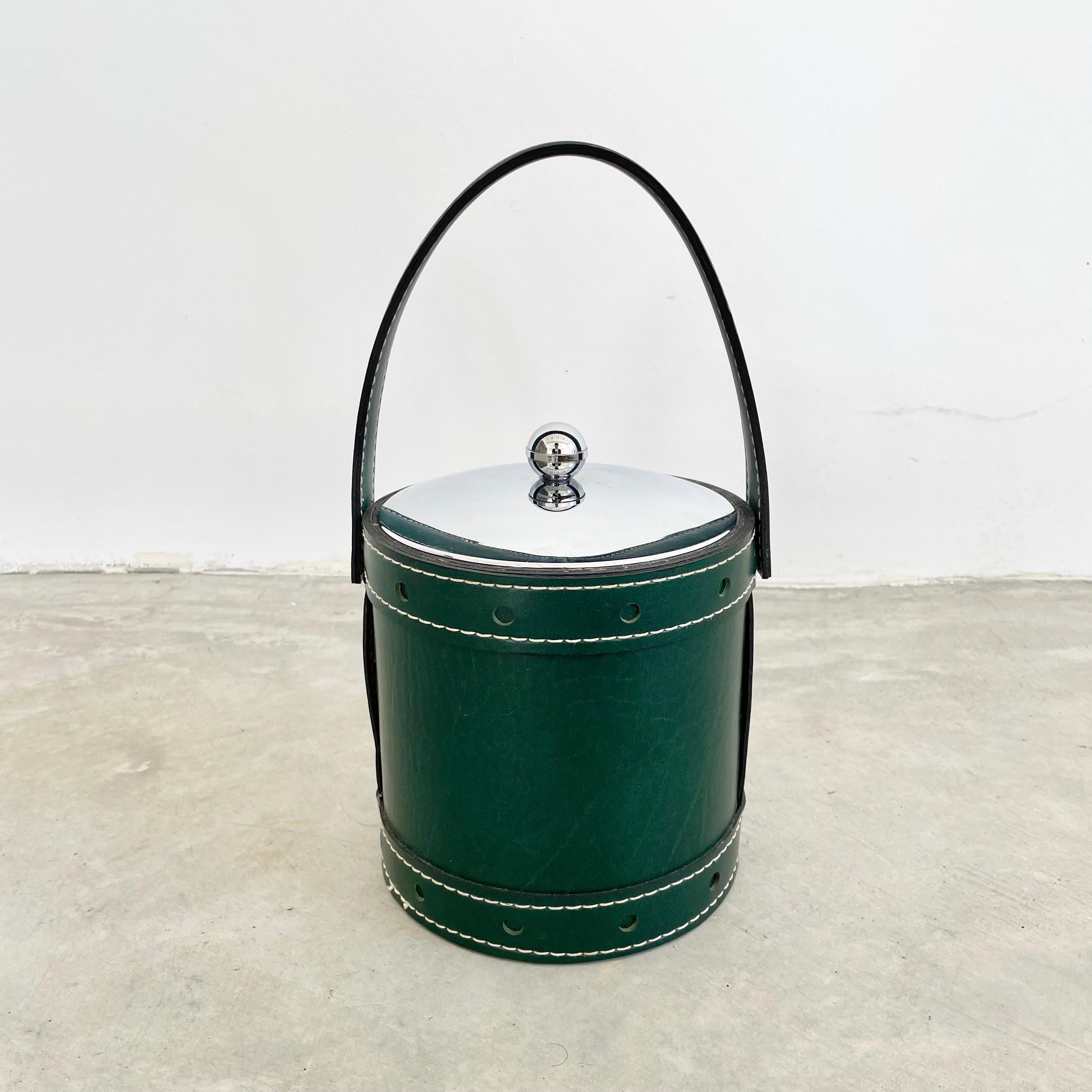 Unique petite champagne bucket/cooler in a beautiful emerald green skai material with silver plastic accents and a candy red interior plastic bucket to hold water/ice. Features a tasteful contrast stitch on every seam give this cooler an elevated