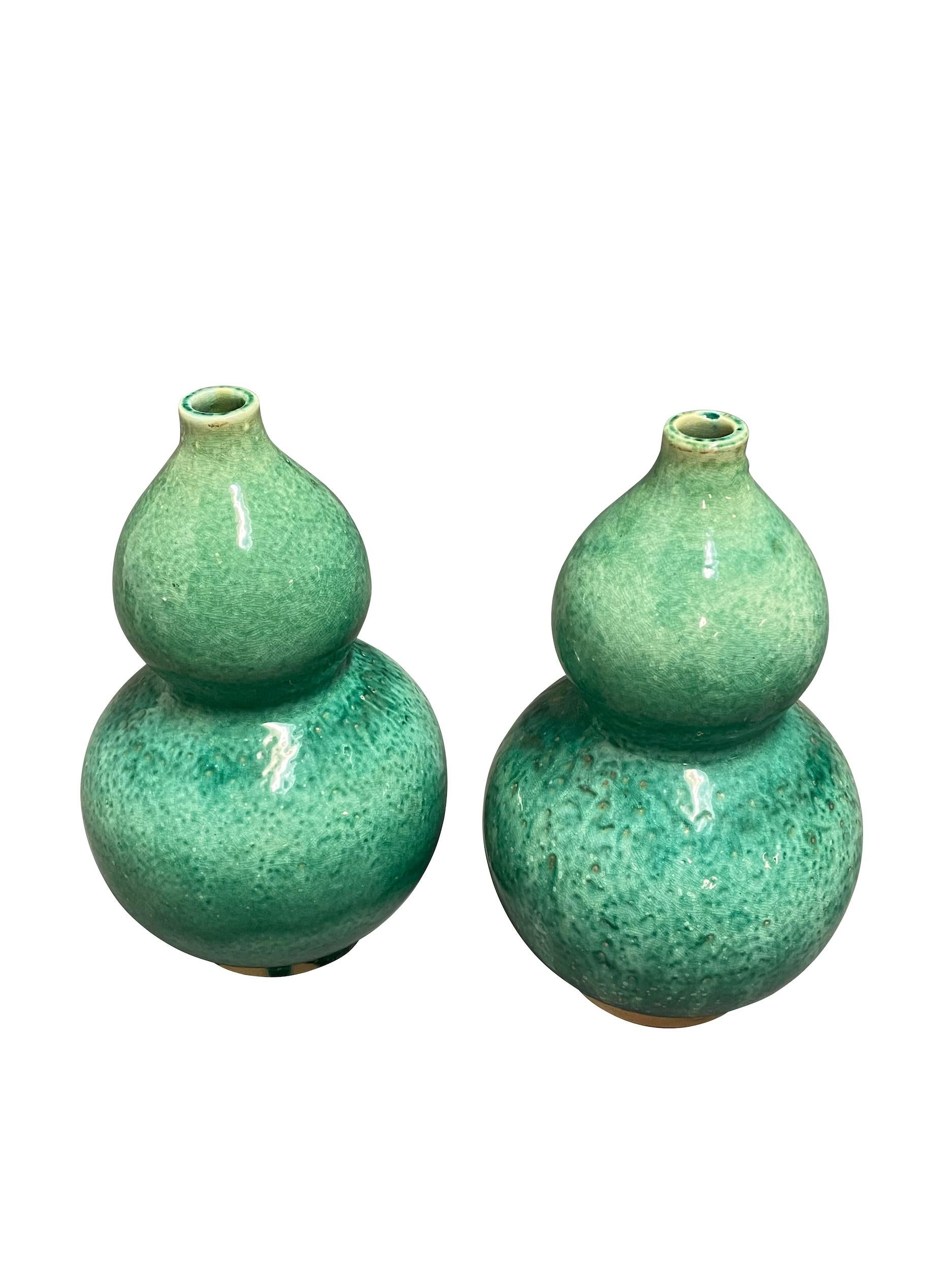 Contemporary Chinese gourd shaped vase with a mottled emerald glaze.
Two available and sold individually.
