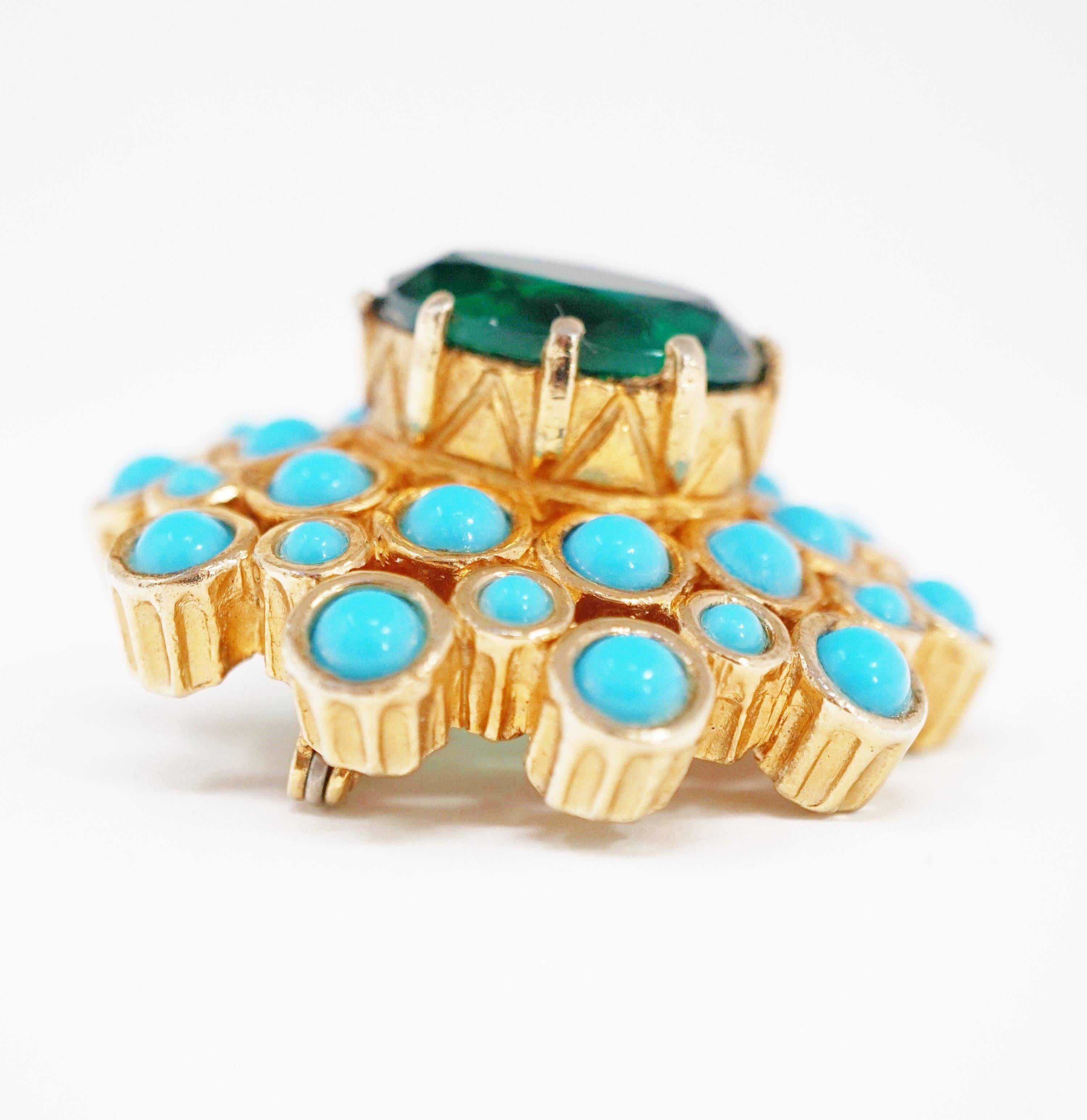 A wonderful example for the Mid-Century Modern jewelry collector, this beautiful vintage gold-tone statement brooch with vivid Emerald-colored rhinestone surrounded by faux Turquoise is by Jerry DeNicola, circa 1960, and signed on the brooch's