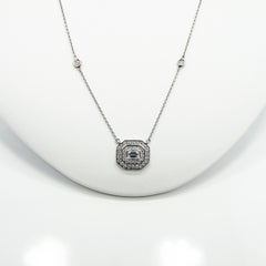 Emerald halo mosaic and round diamond bezel necklace
