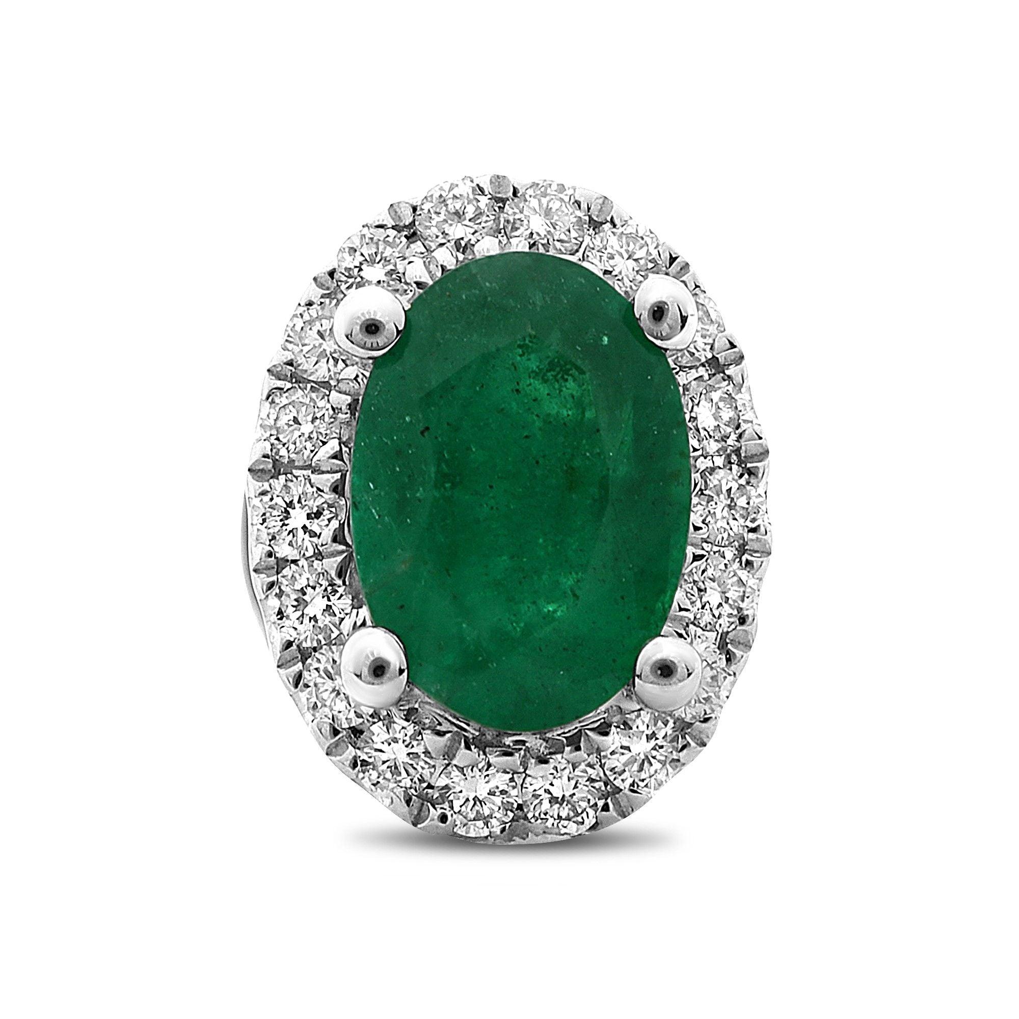 At the center of these eye-catching 18 karat white gold stud earrings rest 0.95 carats of brilliant oval cut emeralds. A sparkling halo of white diamonds surrounds each center stone with a total weight of 0.16 carats of round cut white diamonds