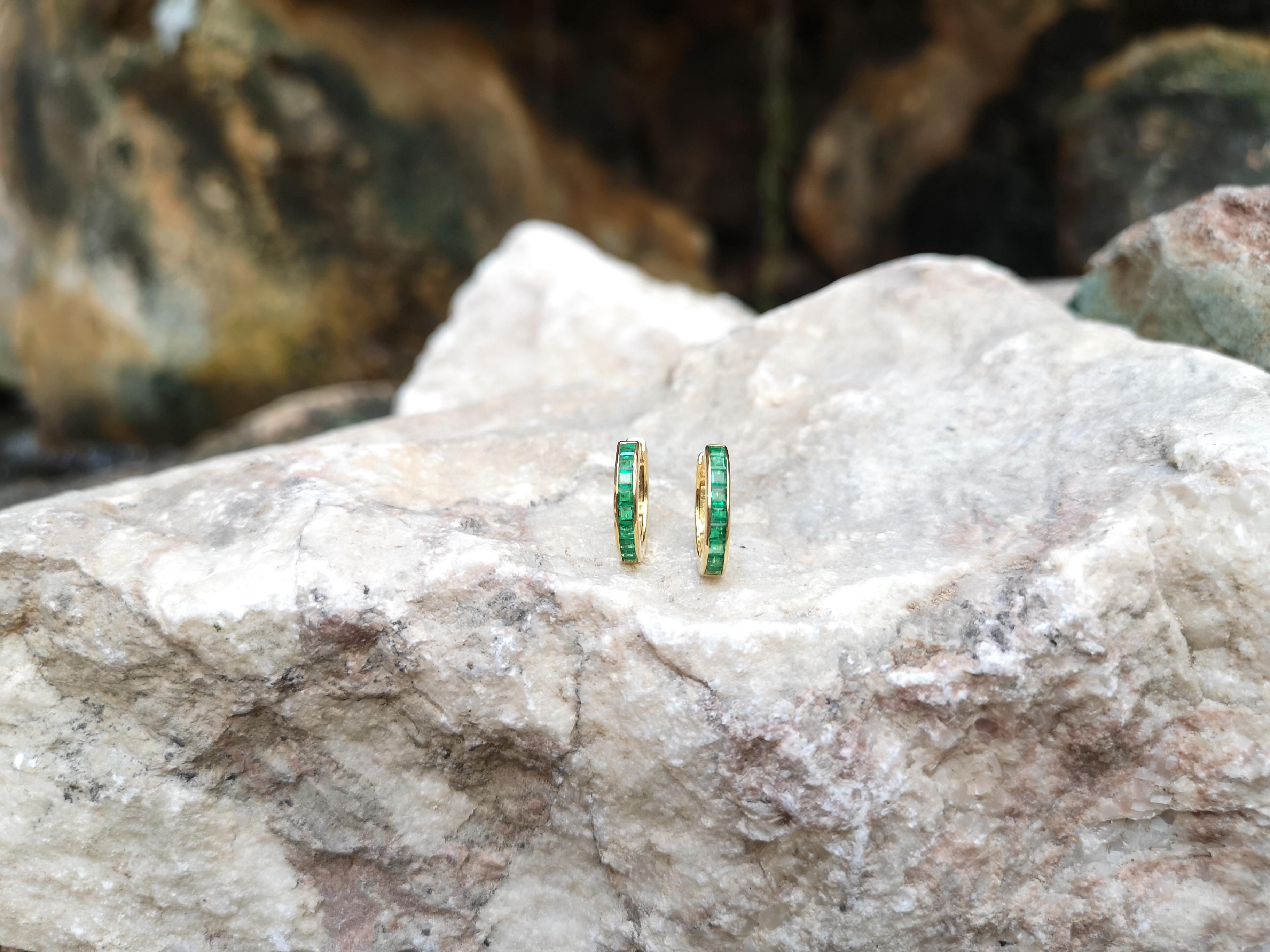 emerald huggie earrings