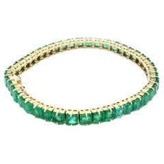 Bracelet ligne d'émeraudes en or jaune 18 carats