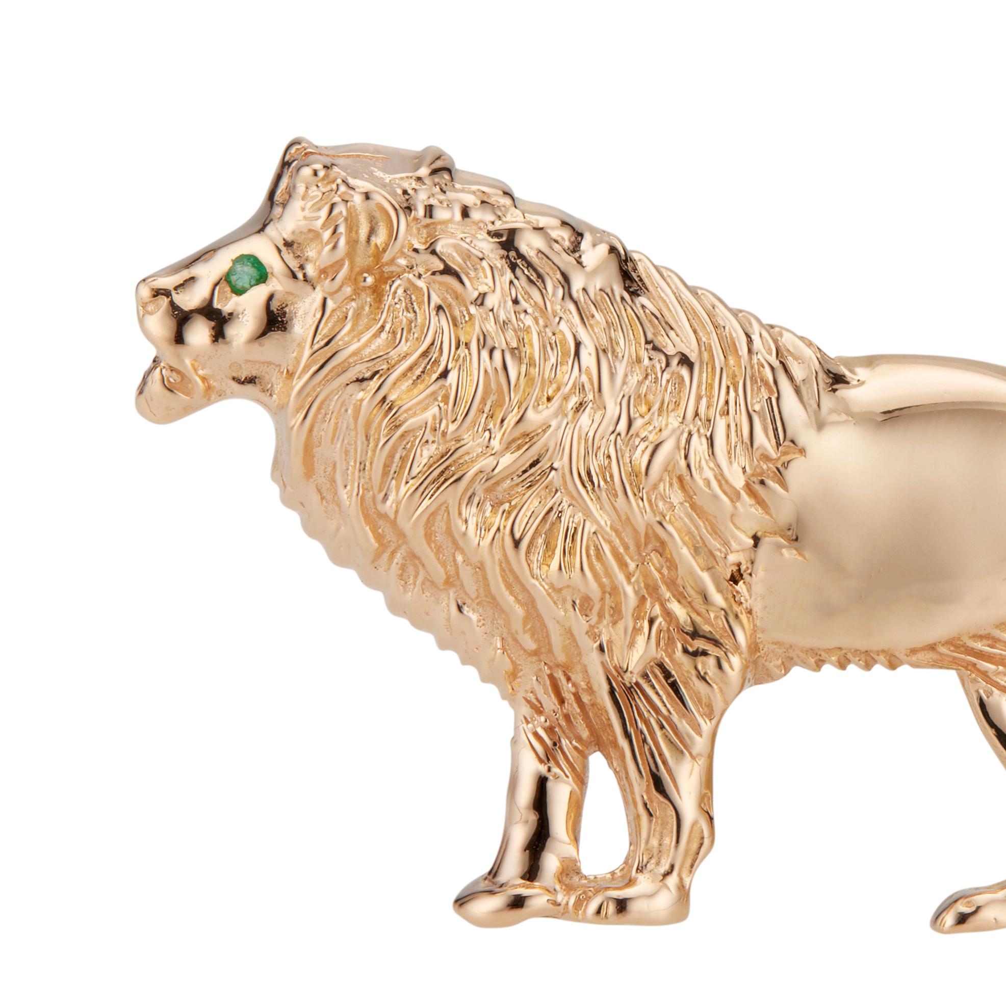14k yellow gold lion brooch with 1 round fancy emerald eye. 

1 fancy emerald 
14k yellow gold
Length: 21.99 mm or 1.65inches 
Weight: 12.4 grams