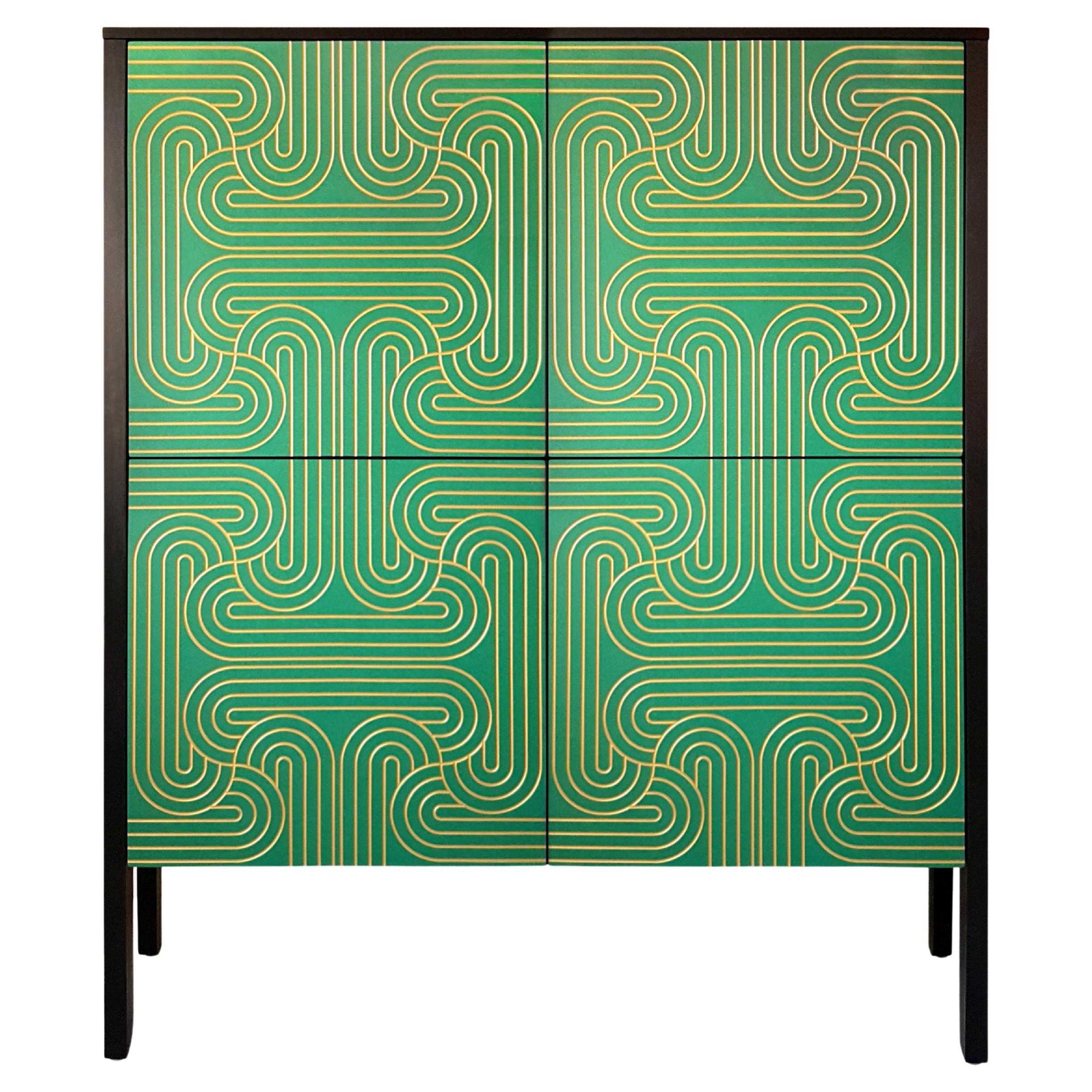 CoucouManou is a small Furniture design and manufacturing company based in the UK which uses pattern and colour in the designs resulting in some striking and elegant pieces of furniture.
The beautiful Loop cabinets in green, blue or black have the