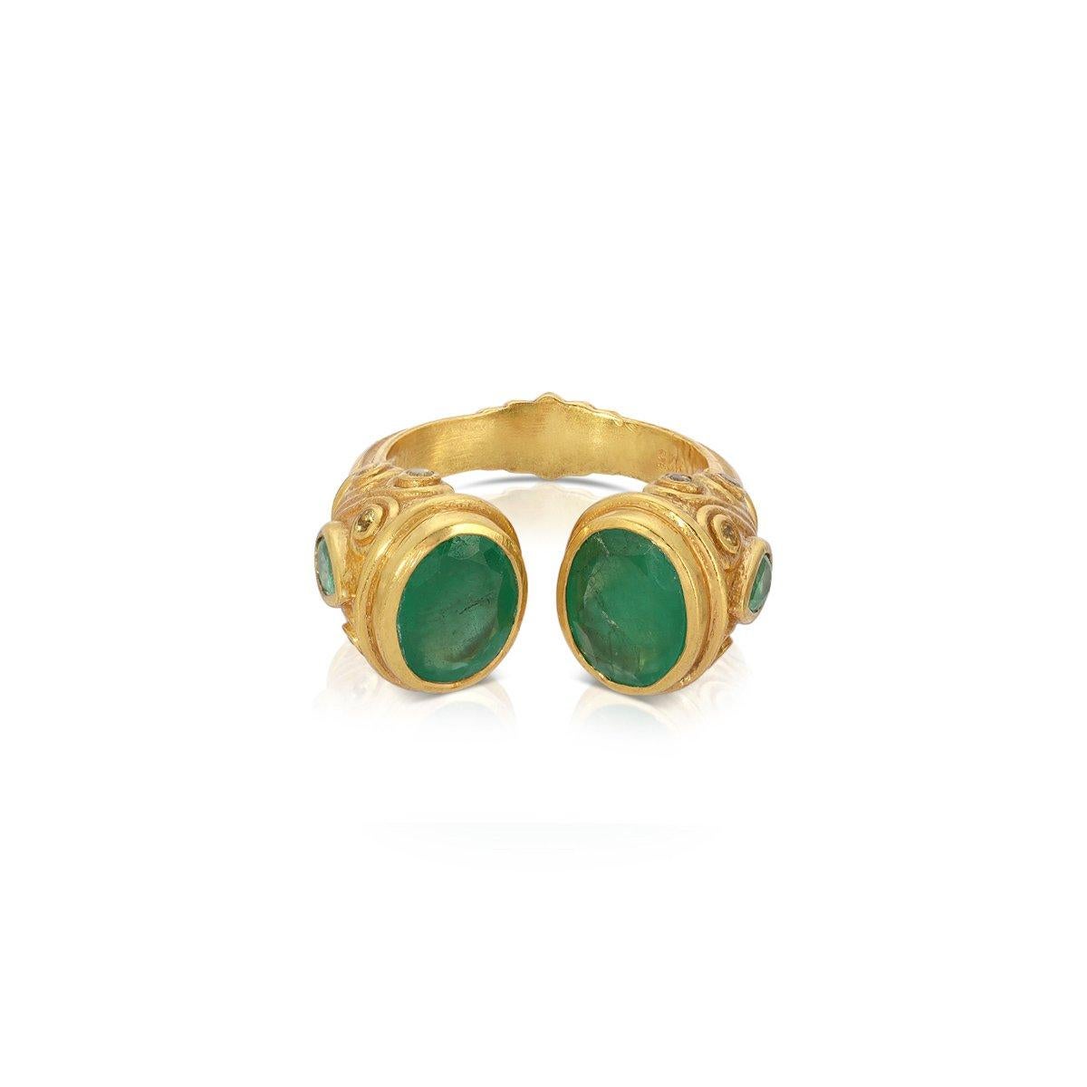 A contemporary interpretation of the opulent jewelry style of the Moguls... An Emerald ring featuring an open ended band tipped with fiery Emeralds and pear shaped Emeralds on the side of the ring. 

- Natural Emeralds weight approx 3.5 Carats.
-