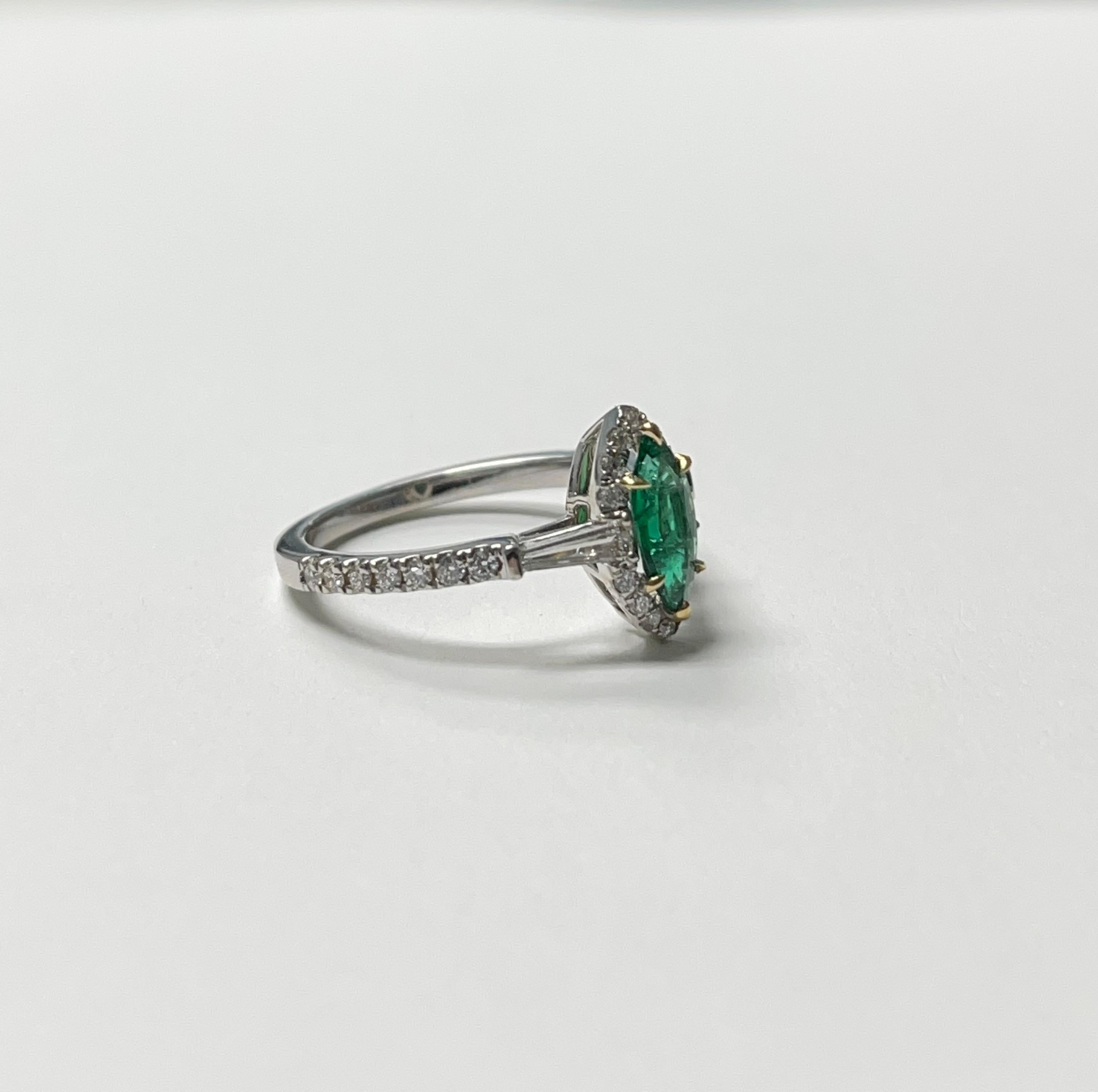 Emerald and diamond ring handmade in 18k white gold. 
The details are as follows :
Emerald weight : 0.50
Diamond weight : 0.60 carat 
Metal : 18k white gold 

