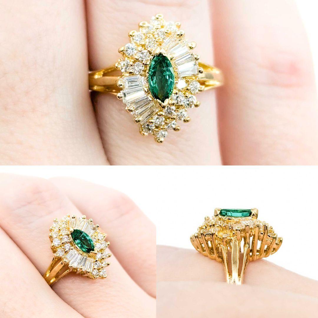 Emerald Marquise & Baguette Diamond Ballerina Ring in Yellow Gold

This exquisite emerald and diamond ring, crafted in luxurious 18k gold, features a mesmerizing emerald and diamond centerpiece with a .21ct marquise-cut emerald, further enhanced